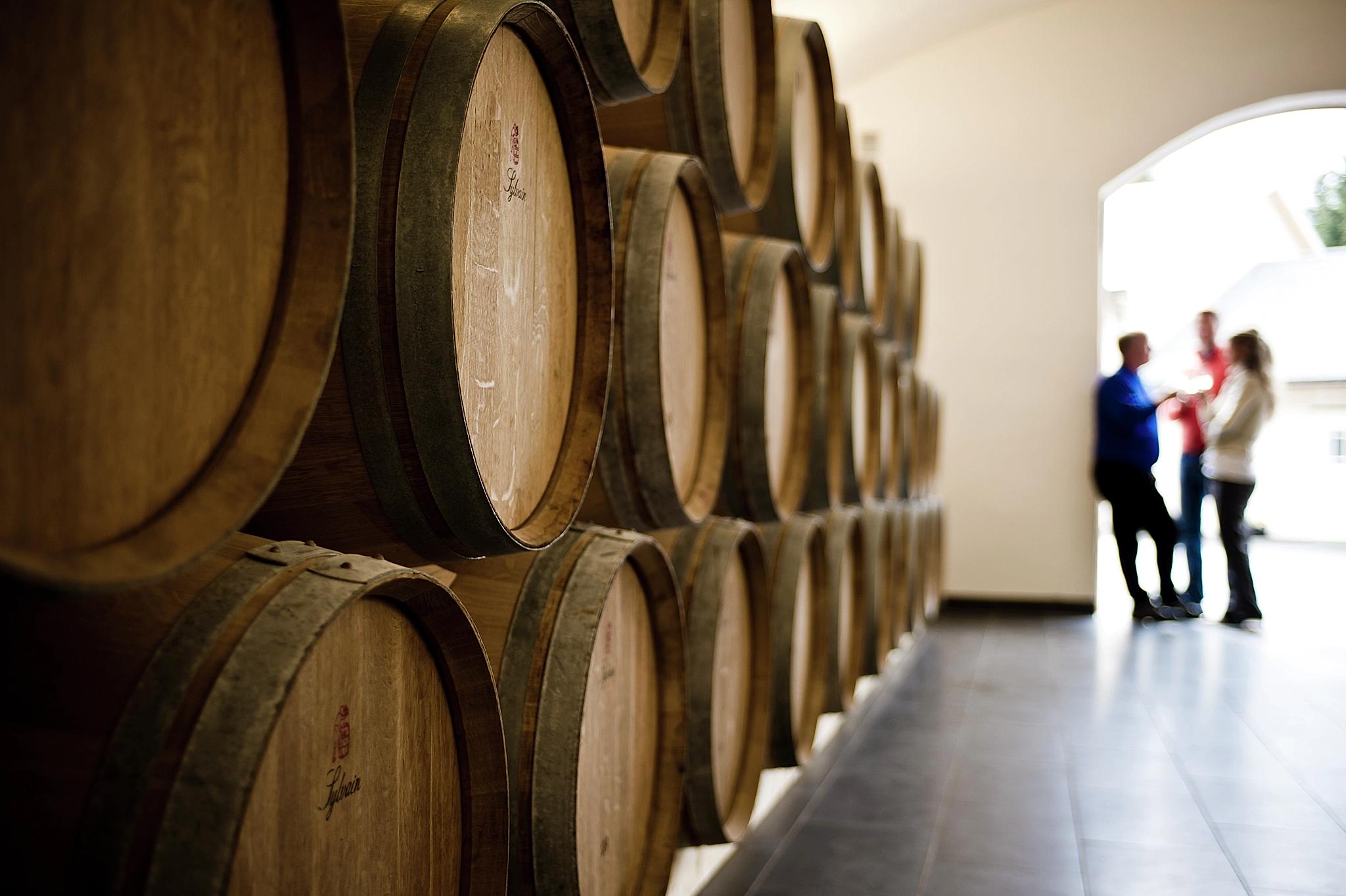 Barrels stacked on top of each other in a warehouse