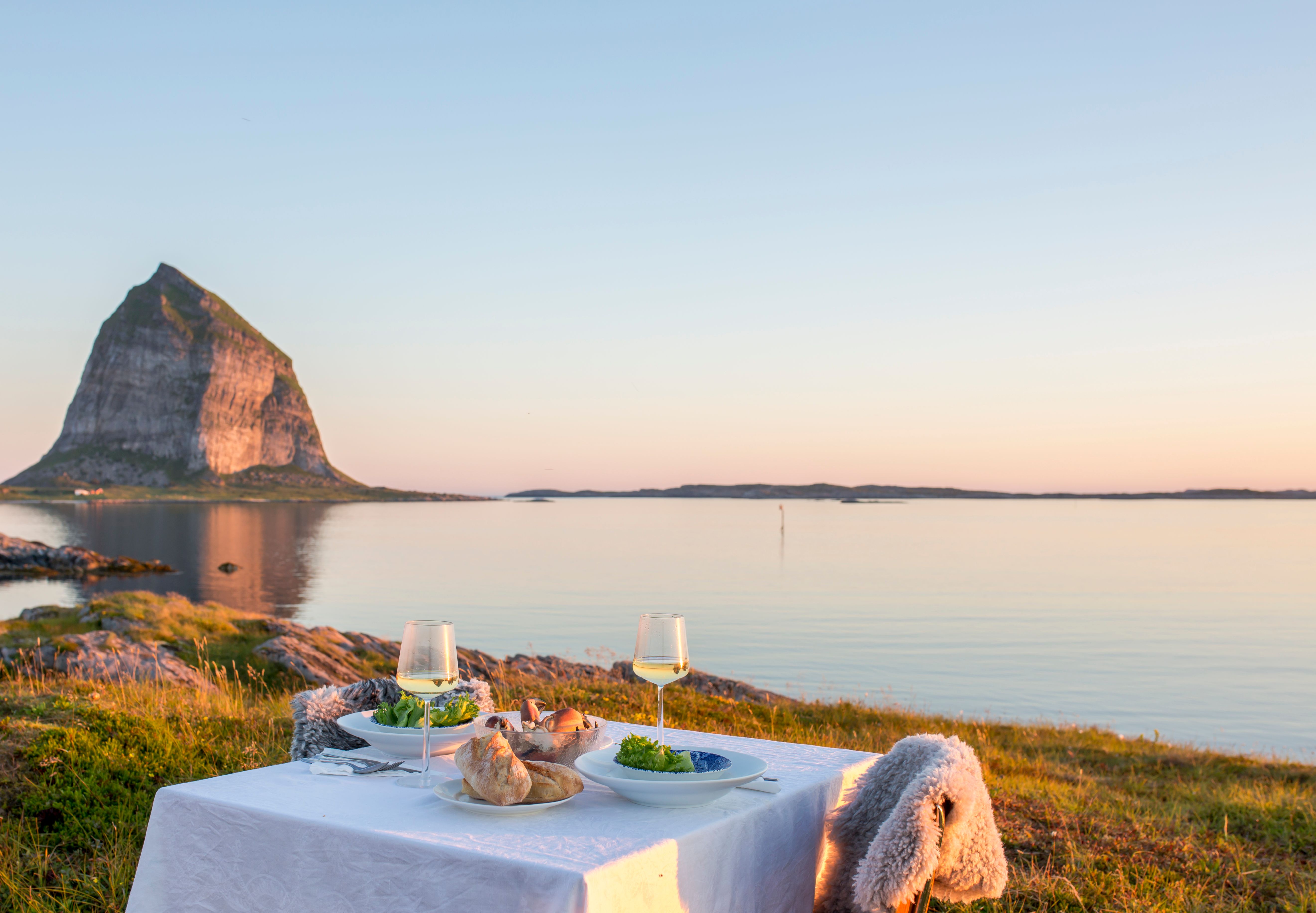 A romantic dinner table by the sea at Træna in Helgeland, Northern Norway