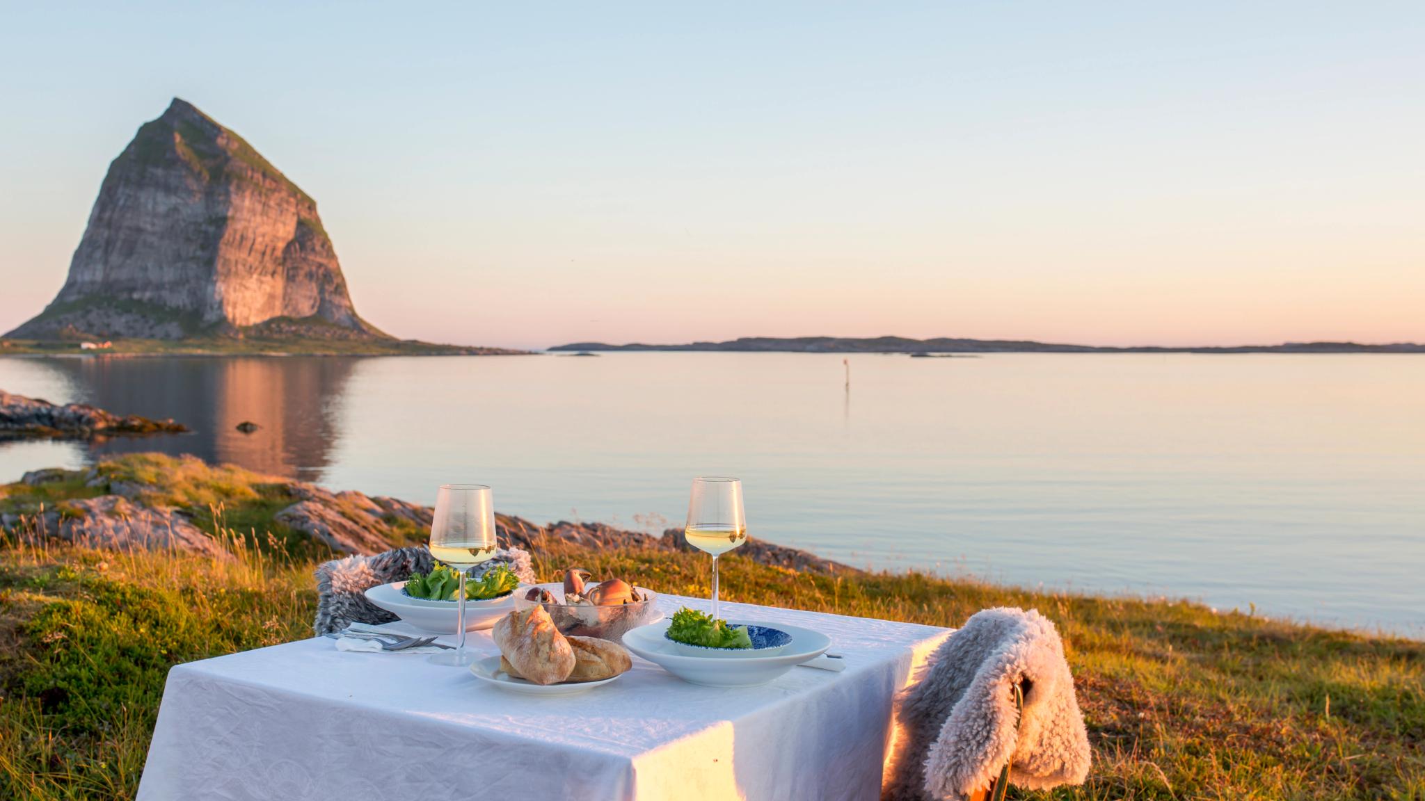 A romantic dinner table by the sea at Træna in Helgeland, Northern Norway
