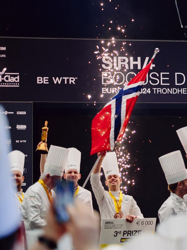 The Norwegian, Danish and Swedish team celebrating on the podium.