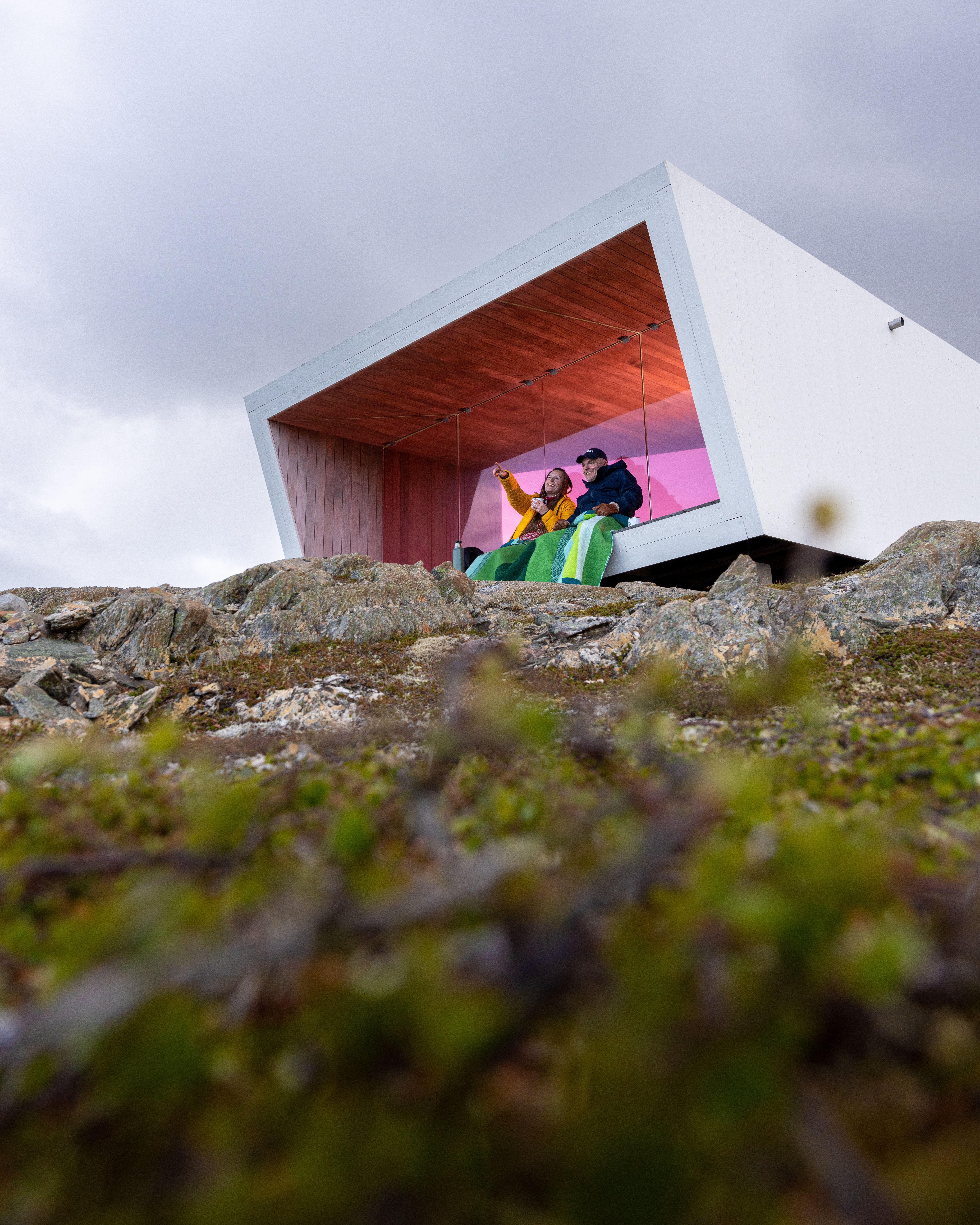 Two poeple sitting in Domen viewpoint by Biptope in Varanger, Northern Norway