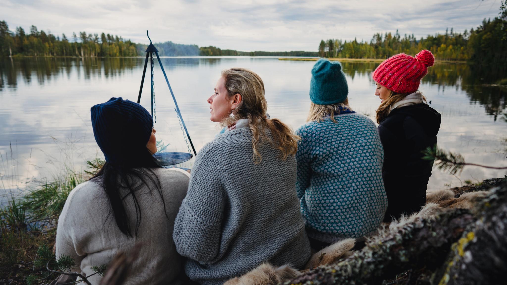 Four women are relaxing by the lake in the Finnskogen forest, Eastern Norway