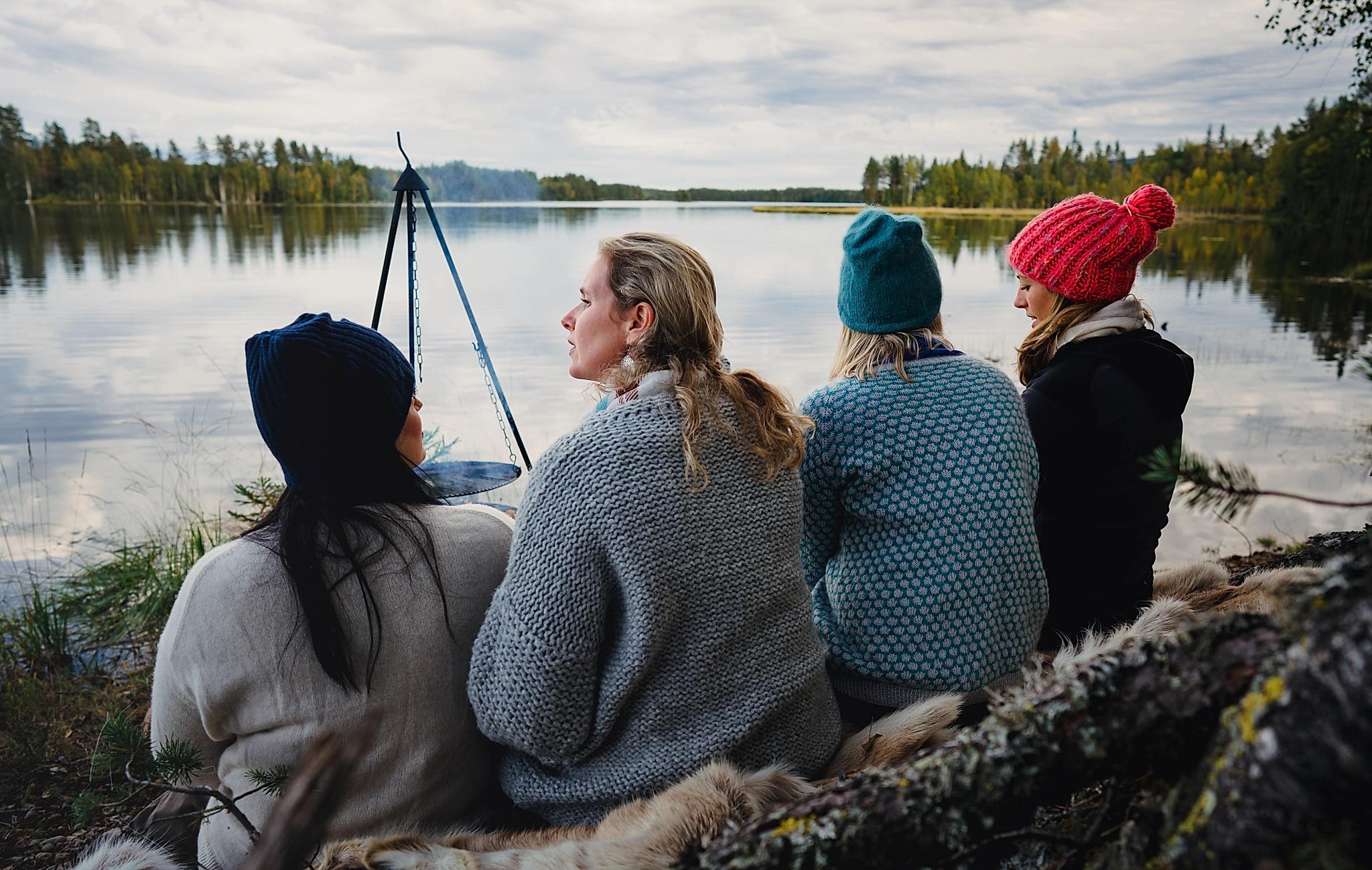 Four women are relaxing by the lake in the Finnskogen forest, Eastern Norway