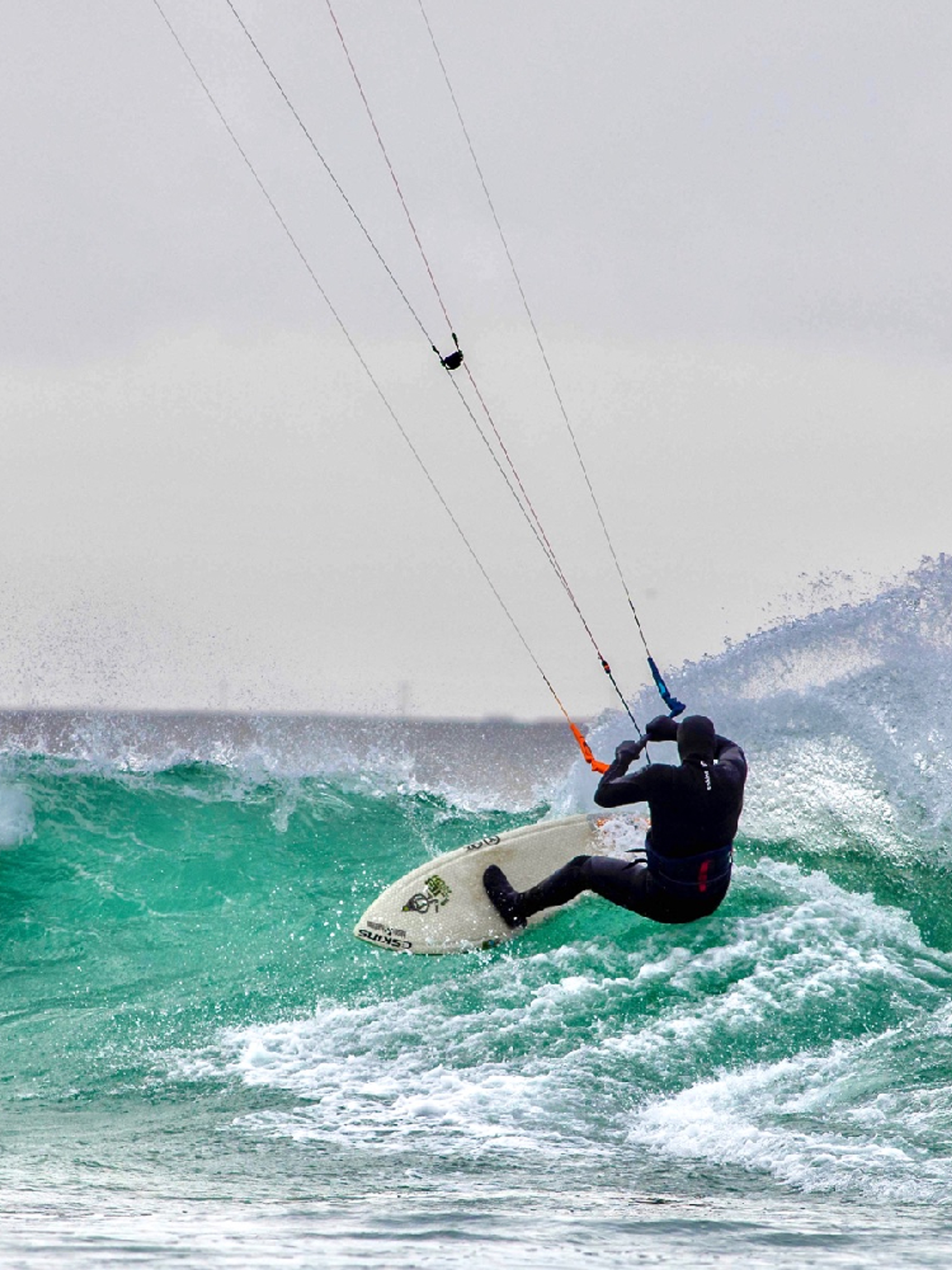 A person kiting on a wave in Fjord Norway.