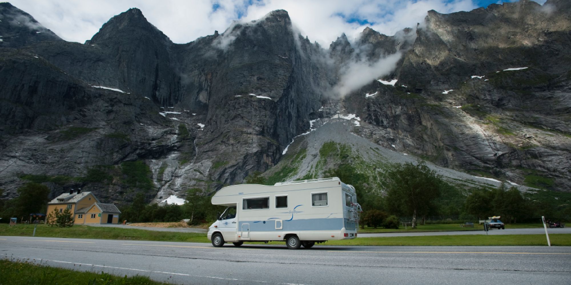 A caravan passing the Troll Wall in Norway