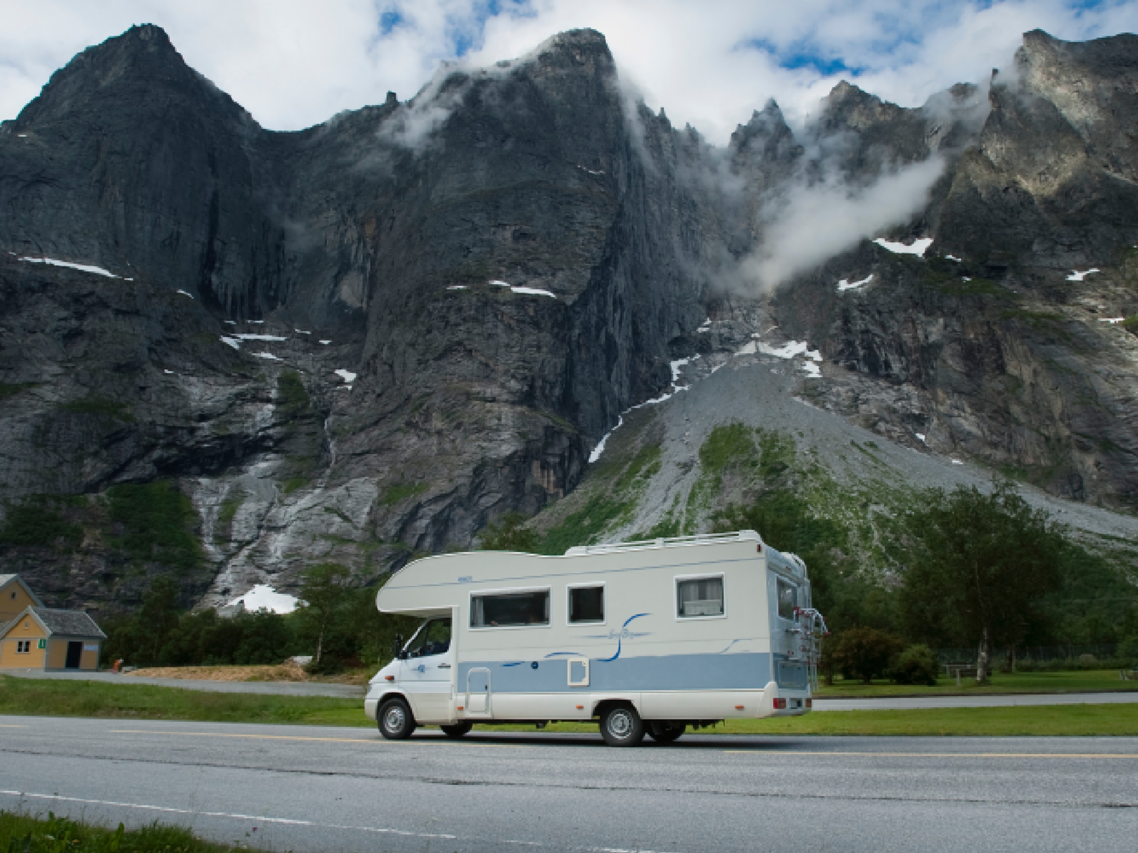 A caravan passing the Troll Wall in Norway