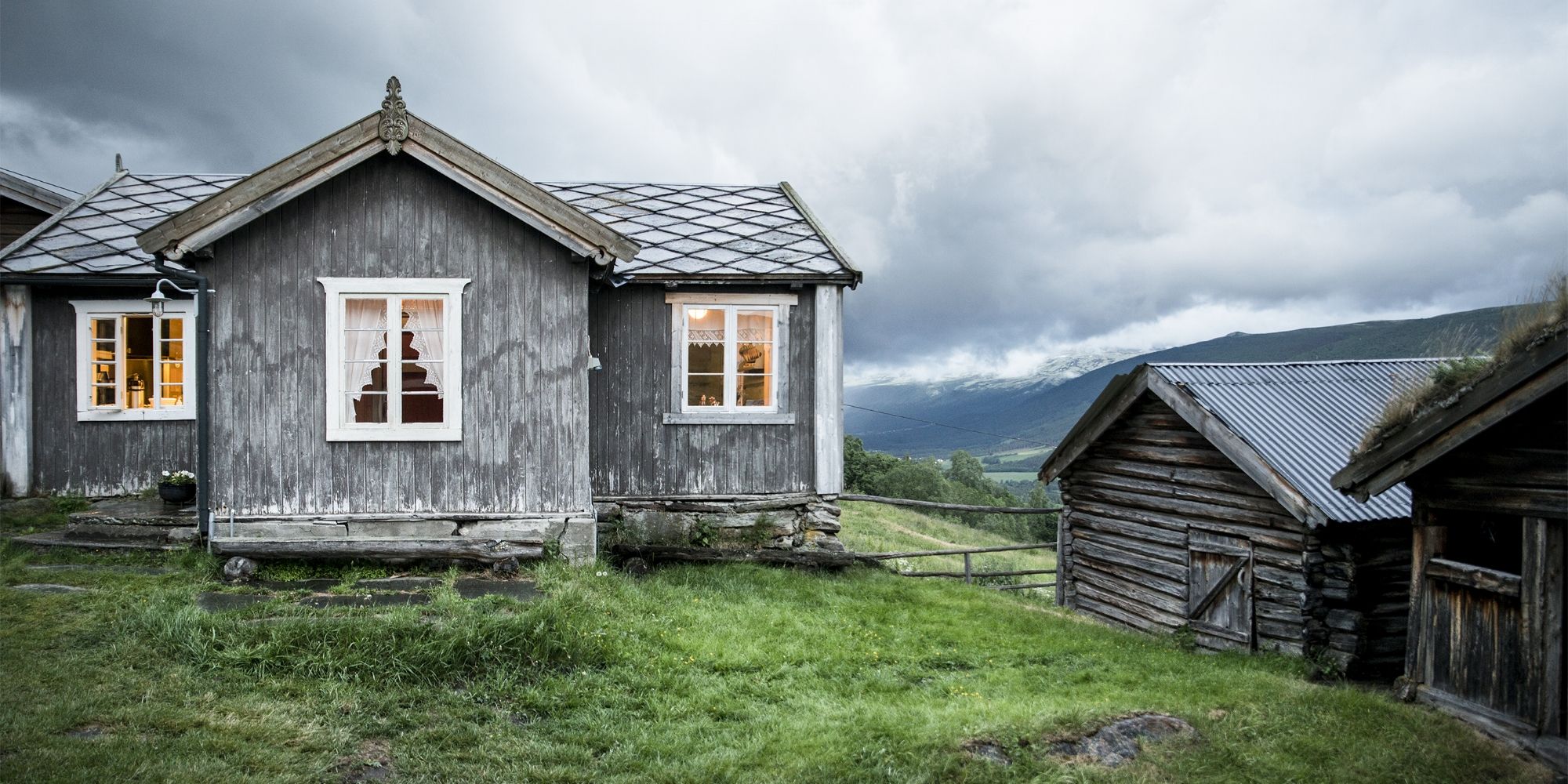 The grey houses of the farm Budsjord in the Gudbrandsdalen valley, Norway