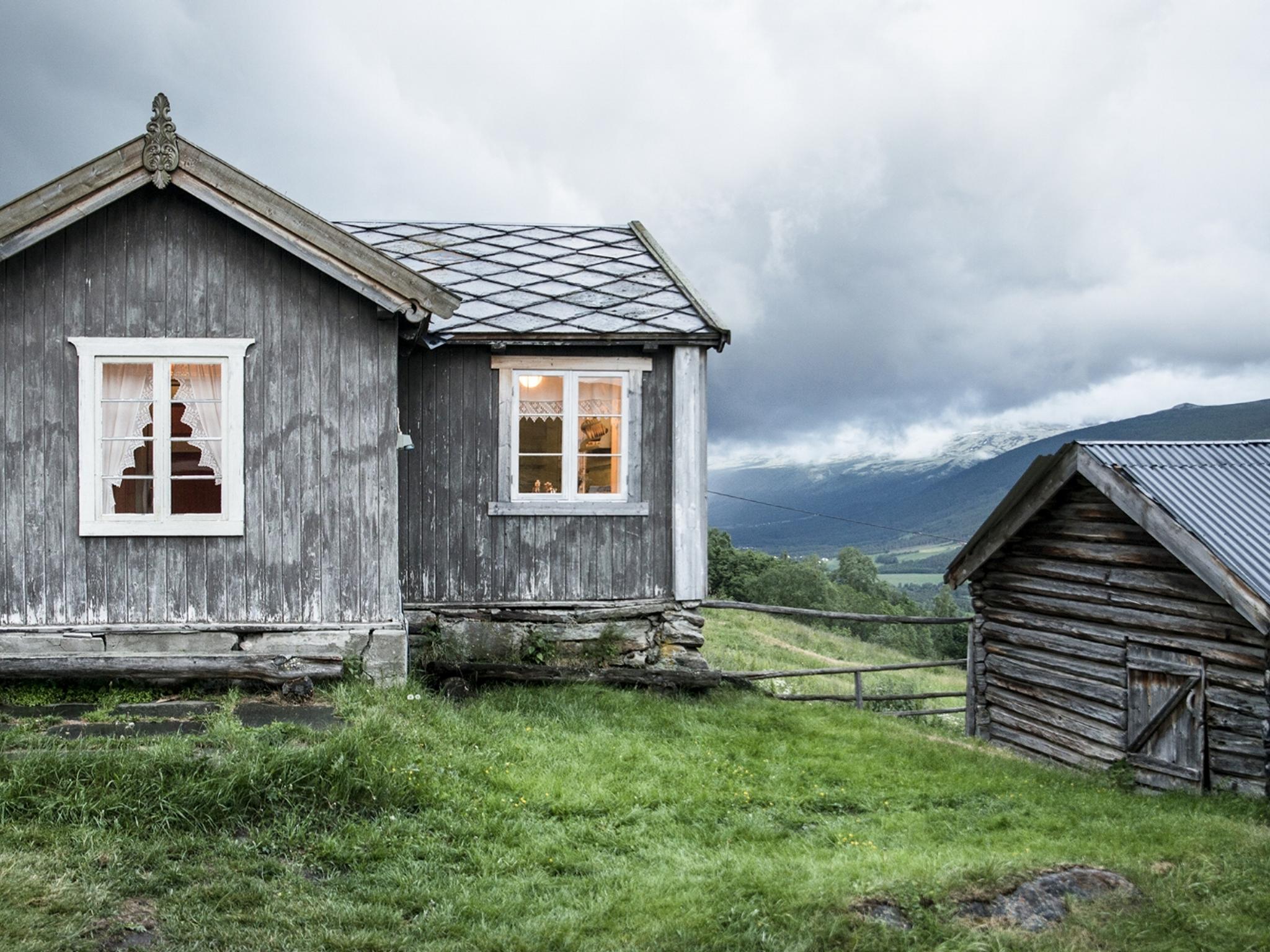 The grey houses of the farm Budsjord in the Gudbrandsdalen valley, Norway