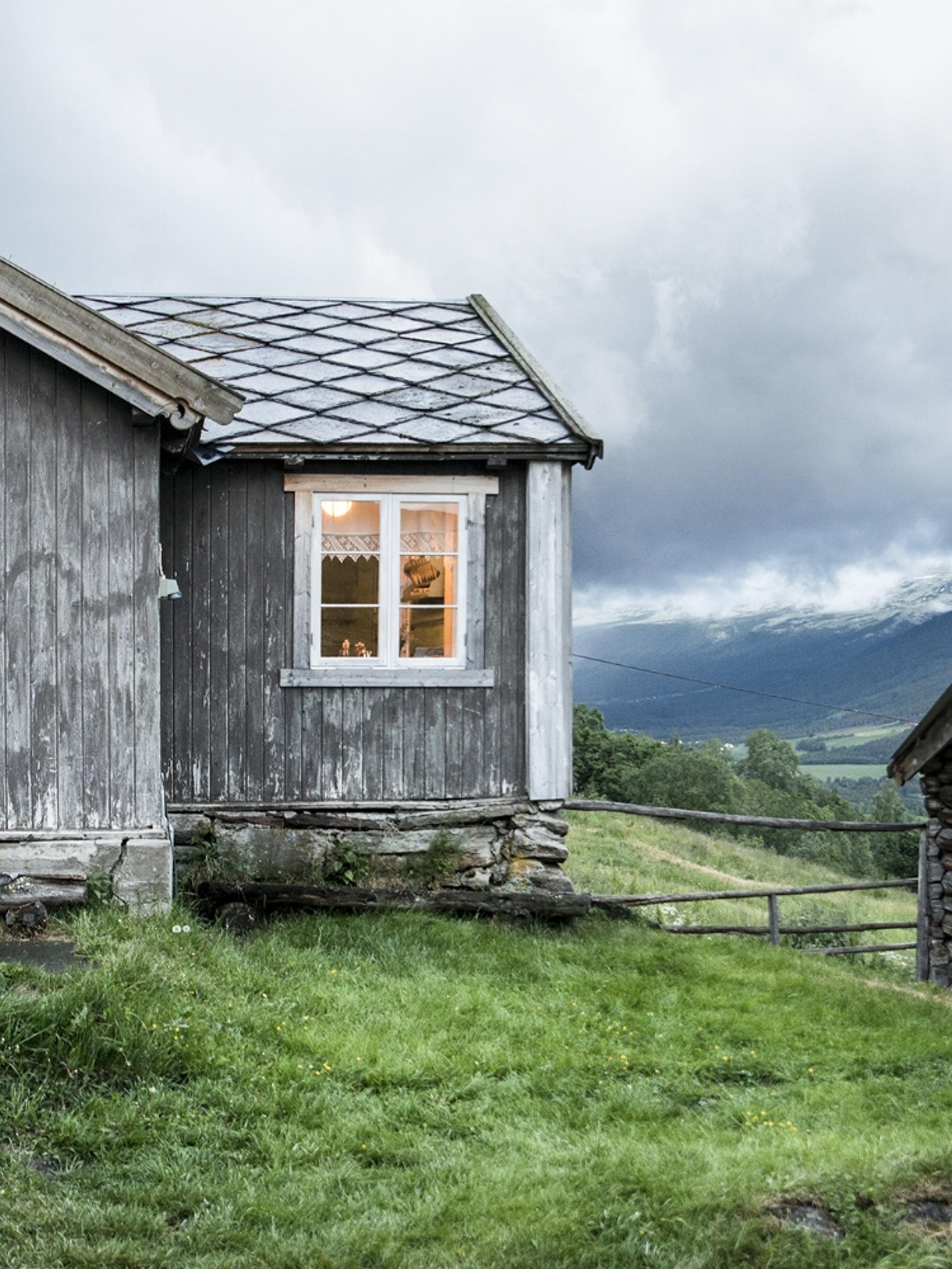 The grey houses of the farm Budsjord in the Gudbrandsdalen valley, Norway