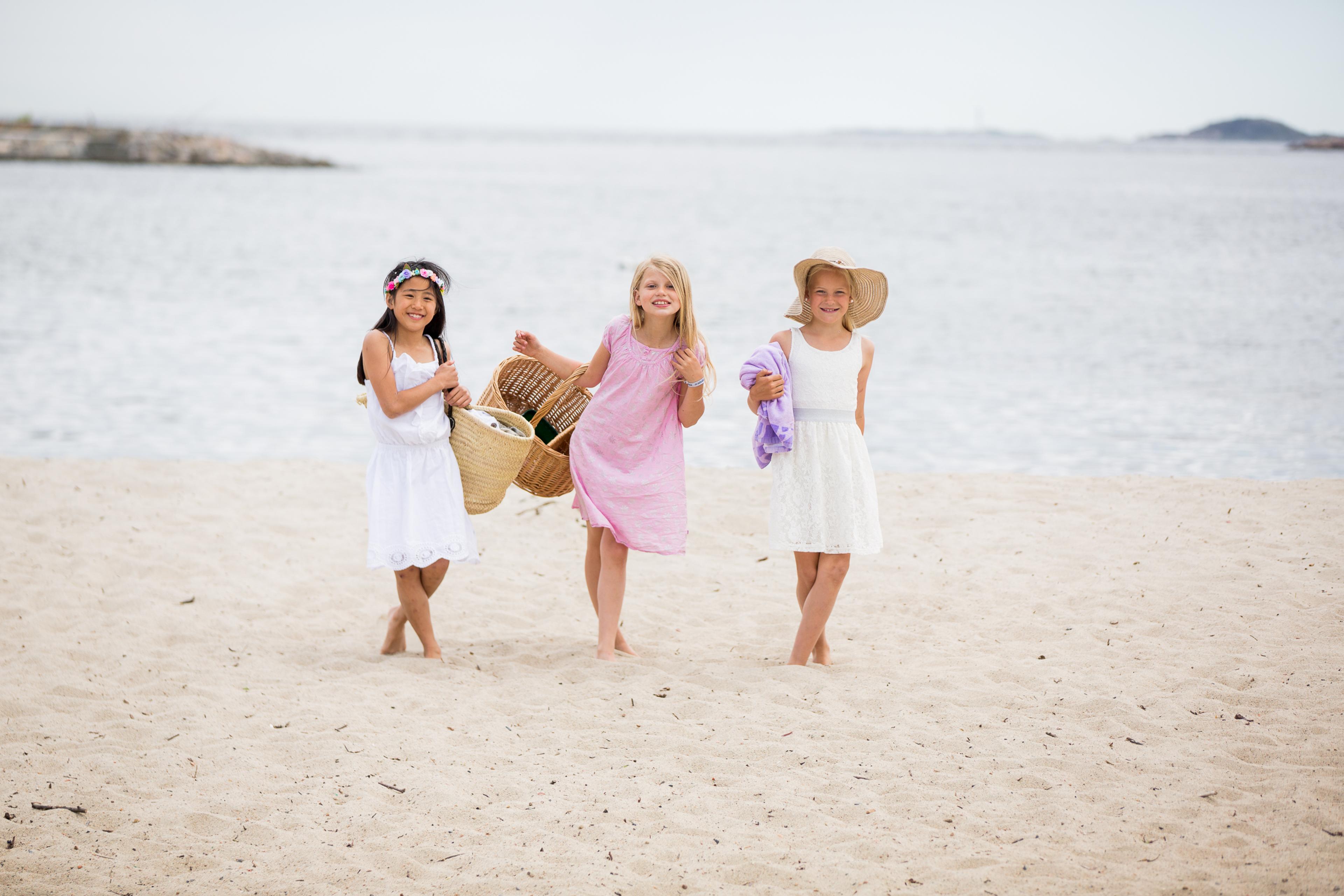 Three children on the Bystranda beach in Kristiansand, Southern Norway
