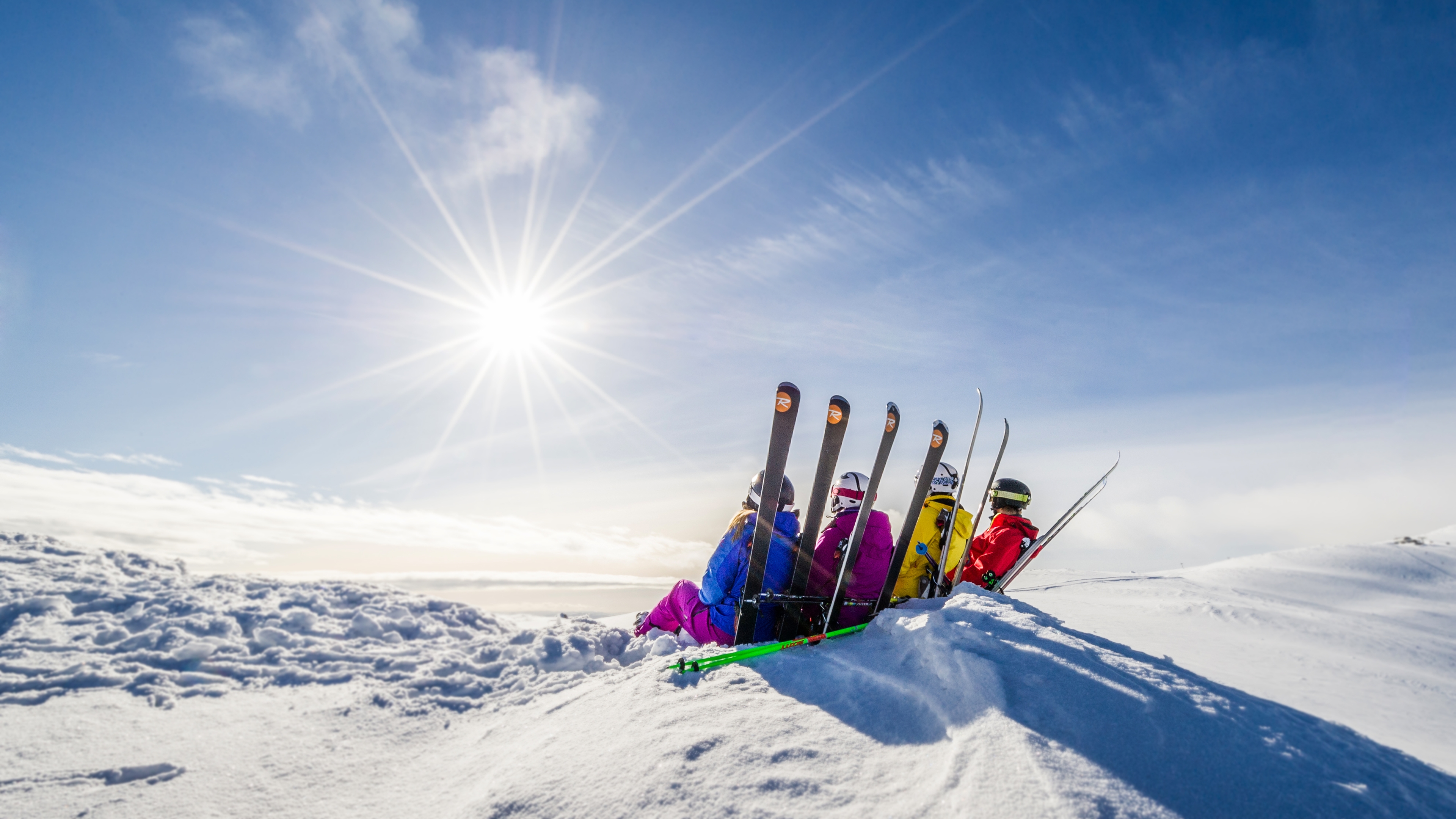 Skiers enjoying a sunny easter day from the mountain top in Trysil, Eastern Norway