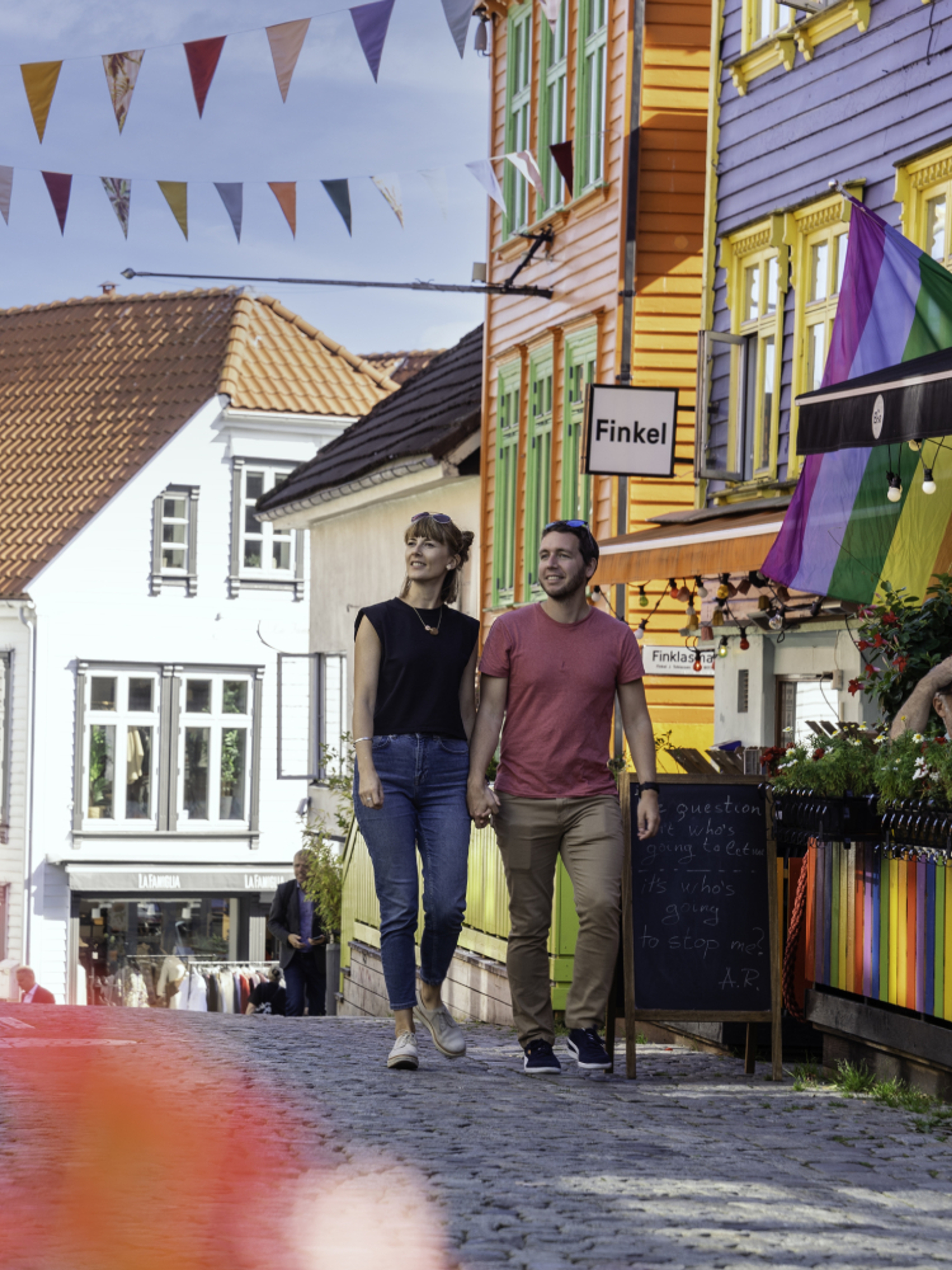 Couple sightseeing in the Color Street in Stavanger