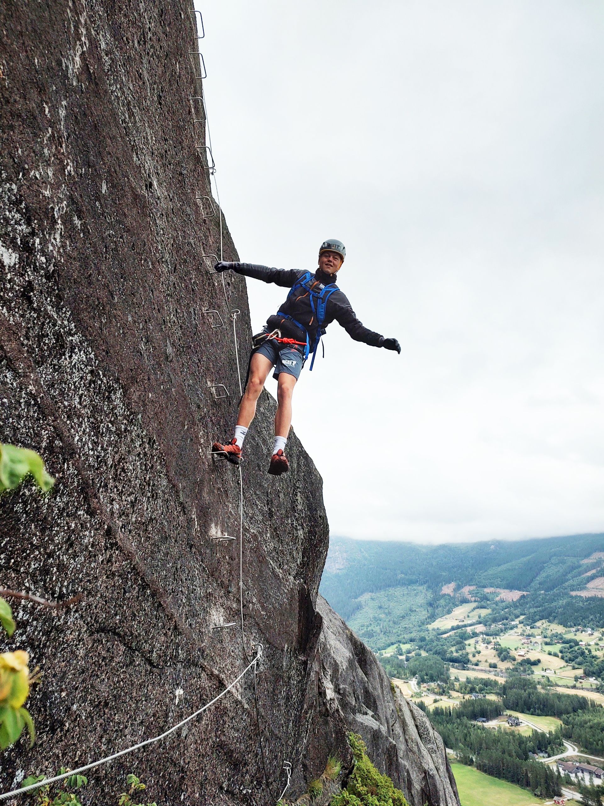 A man climbing in the mountain at the Via Ferrata Nomelandsfjell in Valle