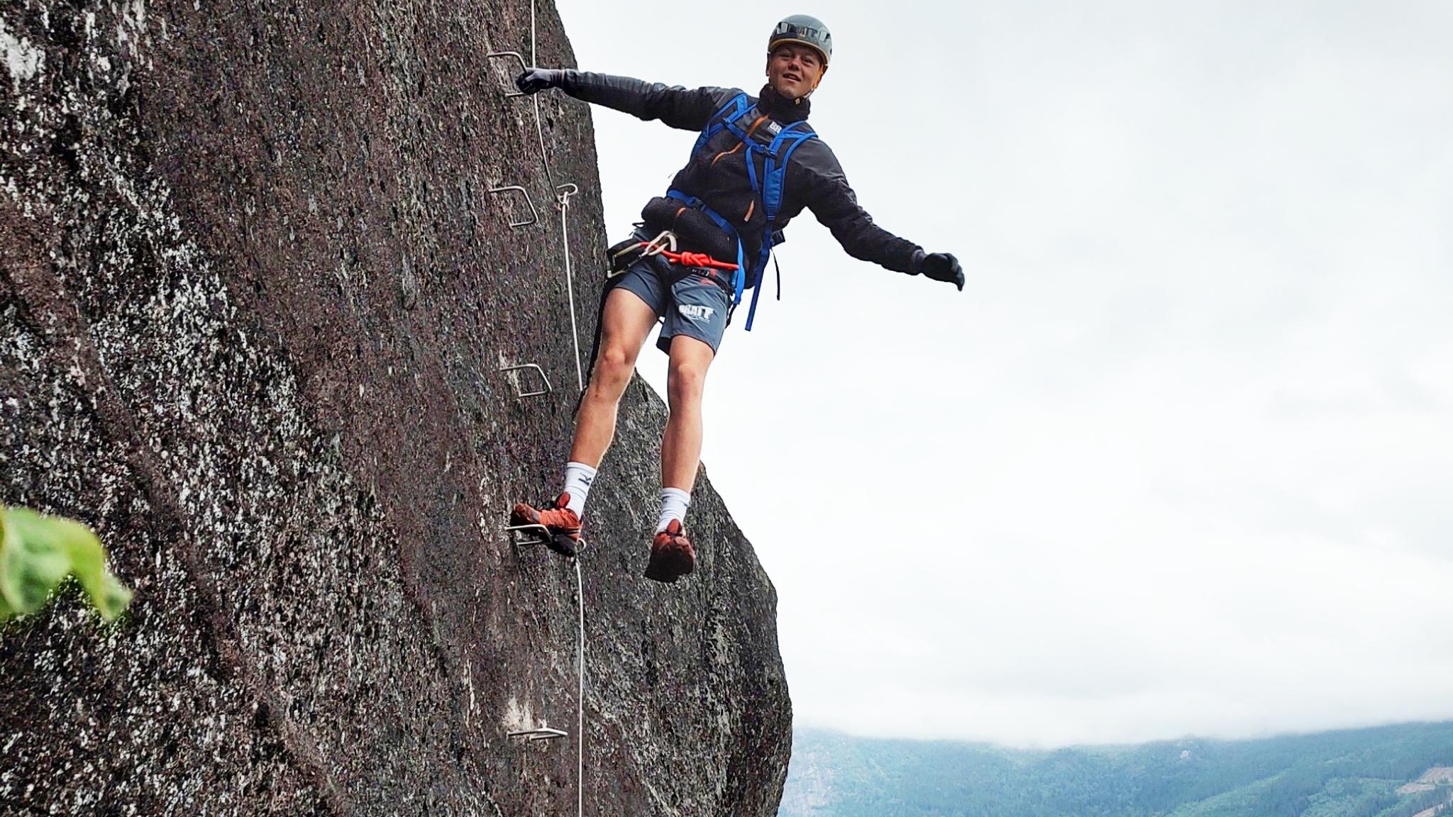 A man climbing in the mountain at the Via Ferrata Nomelandsfjell in Valle