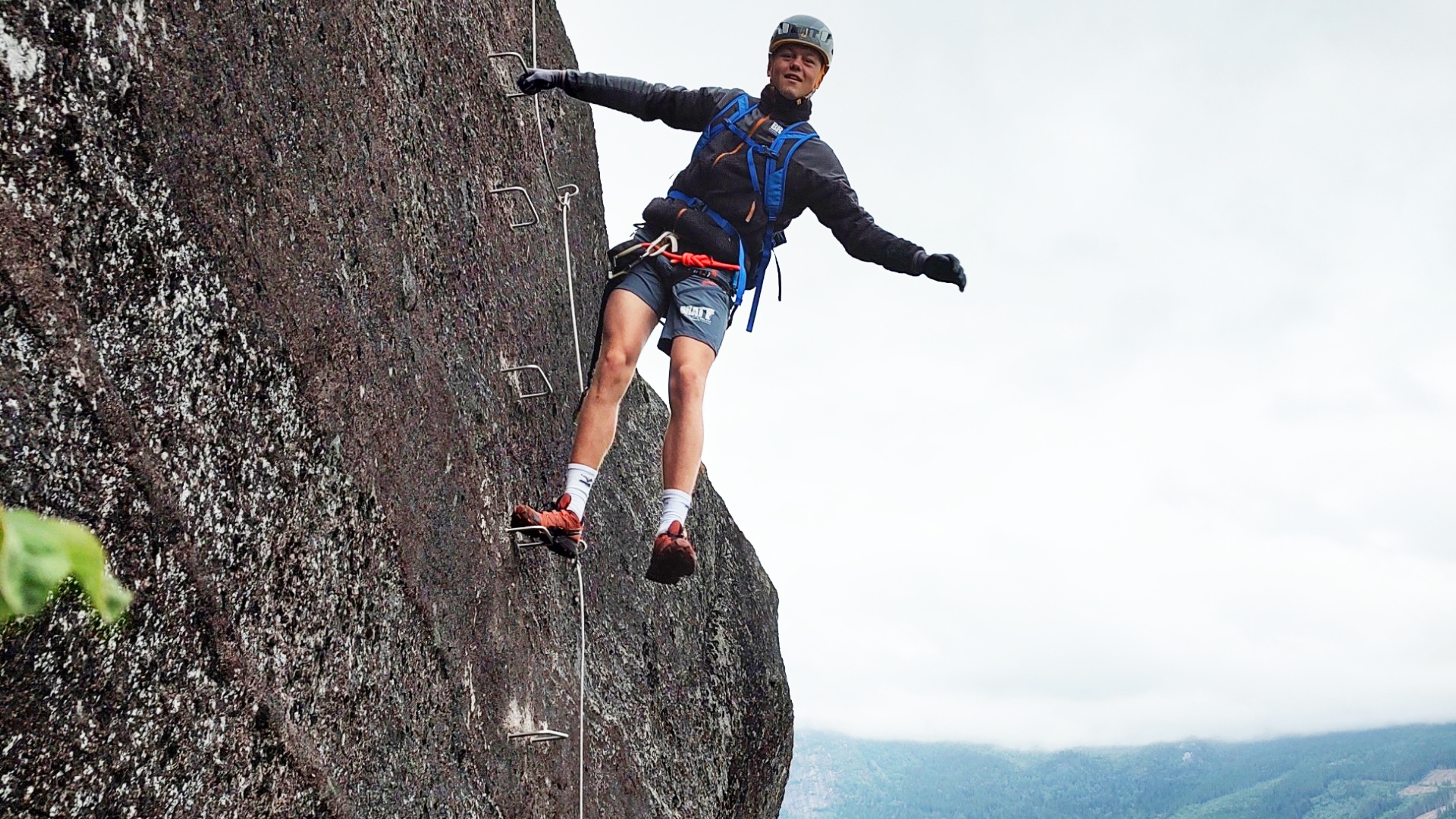 A man climbing in the mountain at the Via Ferrata Nomelandsfjell in Valle