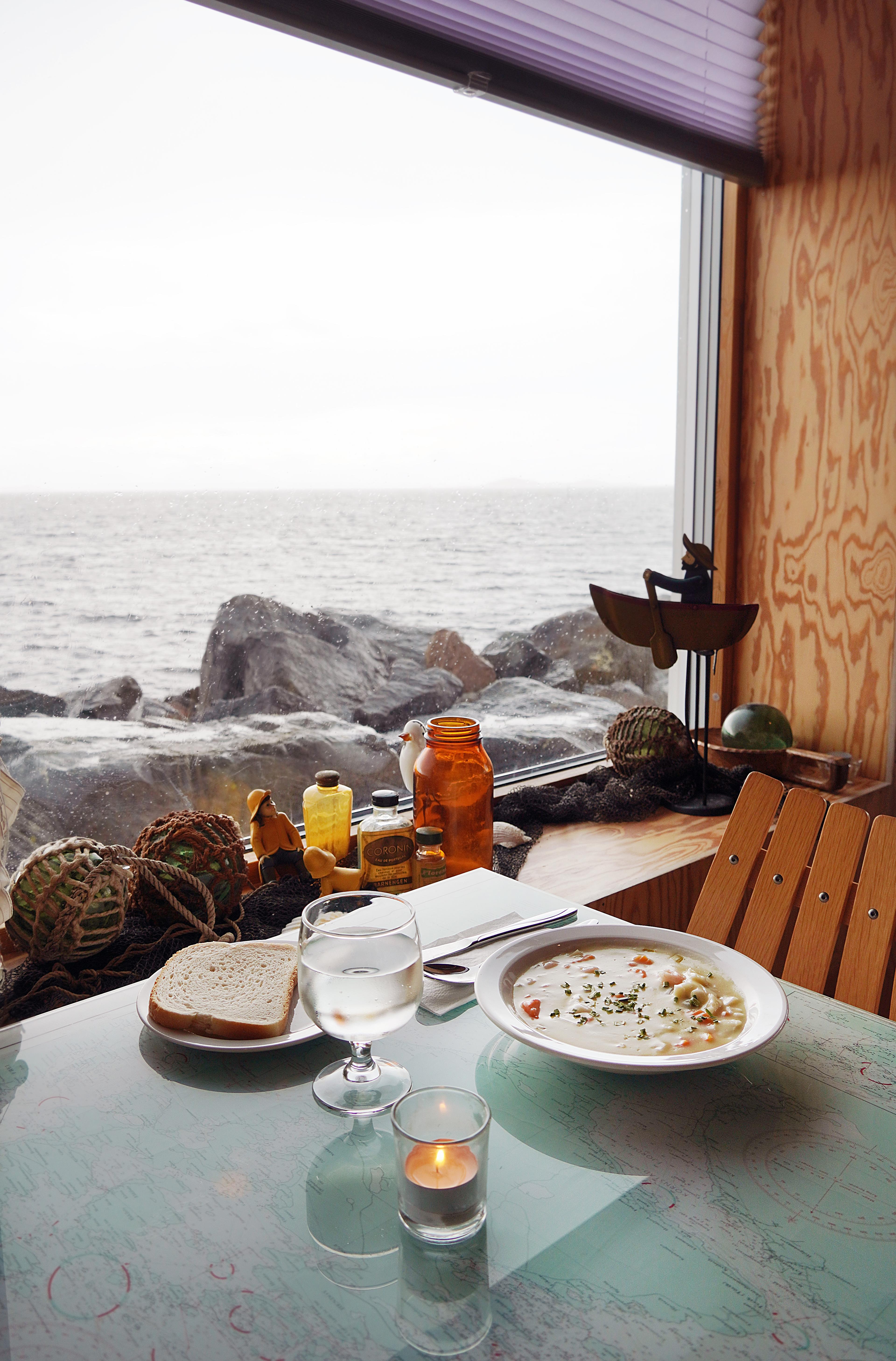 Fish soup at a table at Bryggjen in Bud