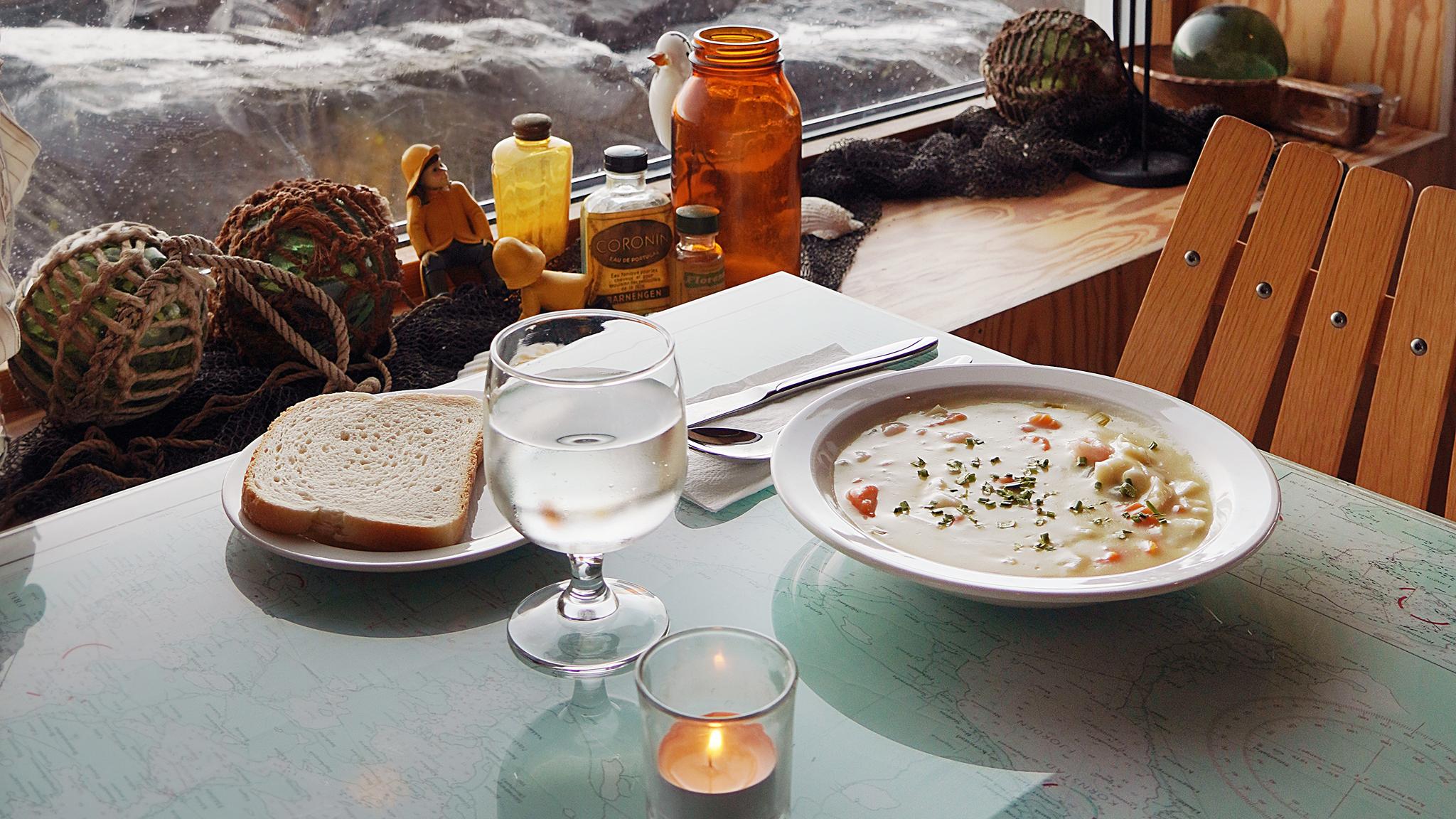 Fish soup at a table at Bryggjen in Bud