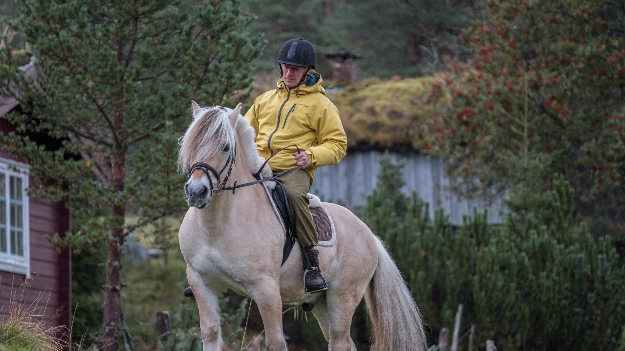 A man riding a Fjord horse in Norway