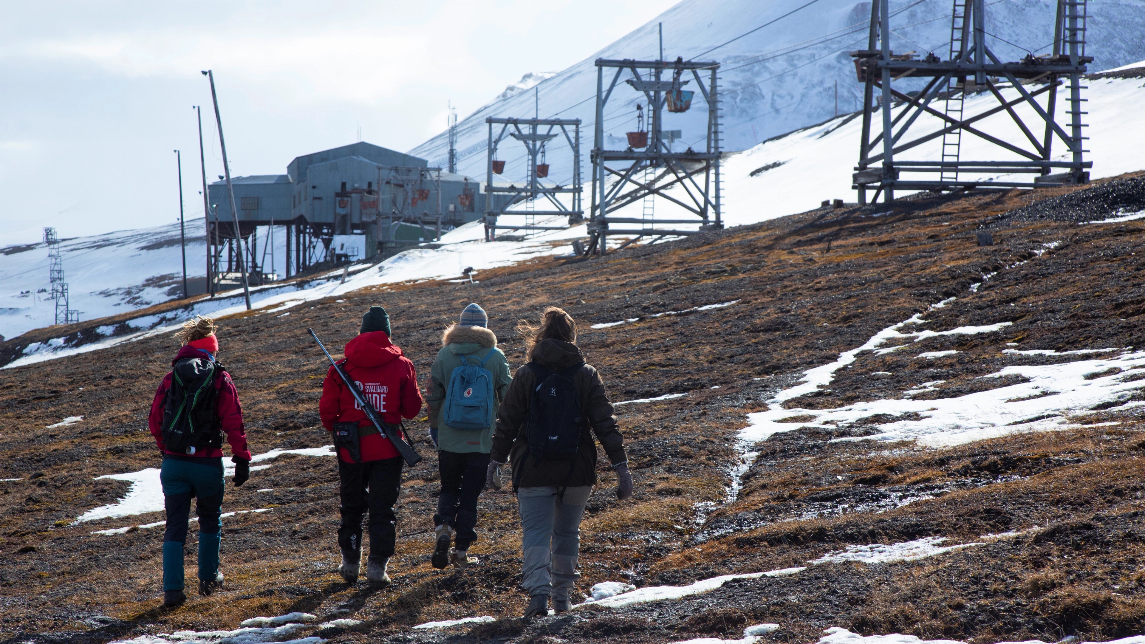 People walking outside Longyearbyen need to go with a guide at Svalbard, Northern Norway