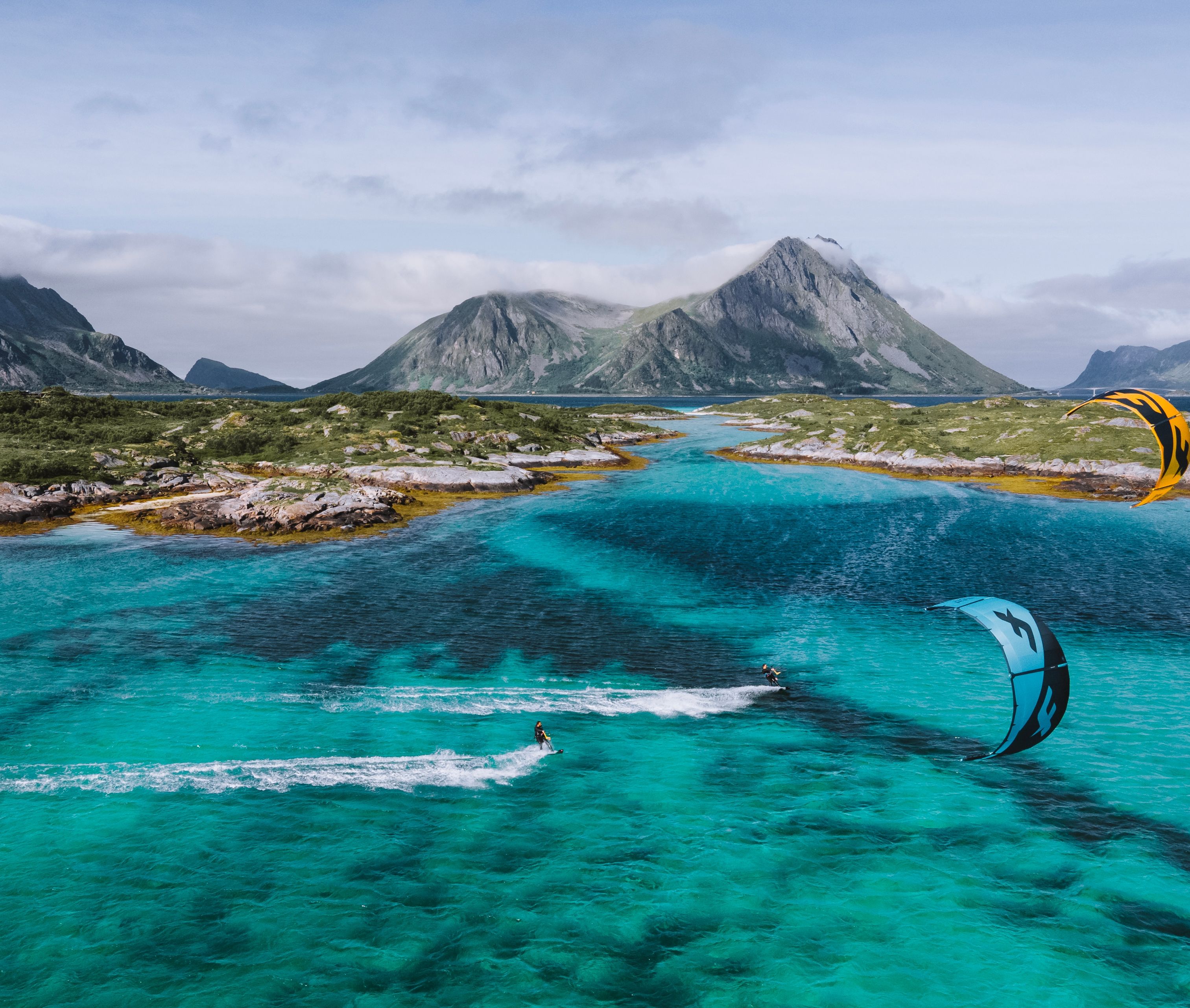 People water kiting outside of the Lofoten Islands, Northern Norway.