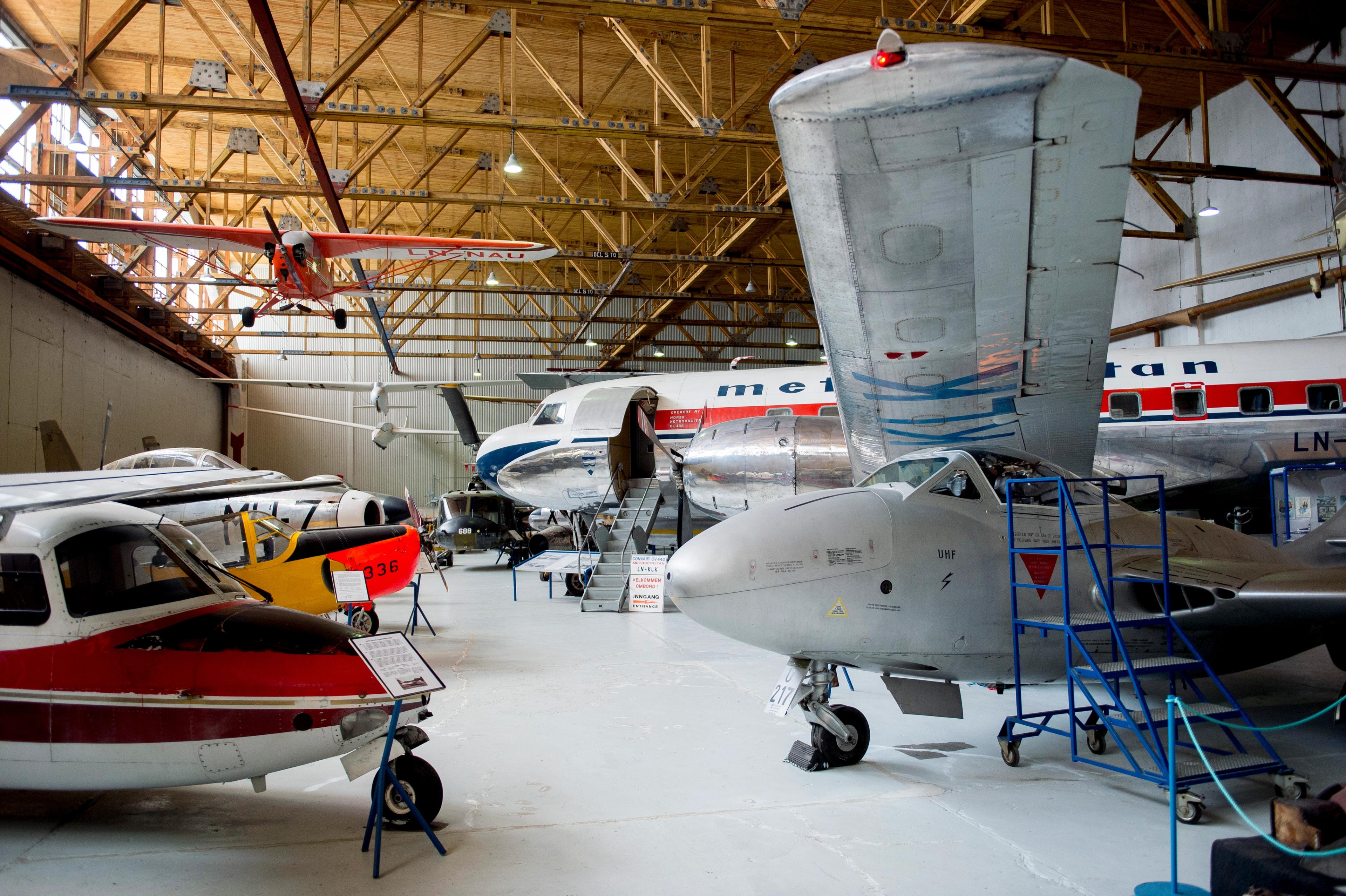 Several planes in the hangar at the museum of aviation history at Sola airport