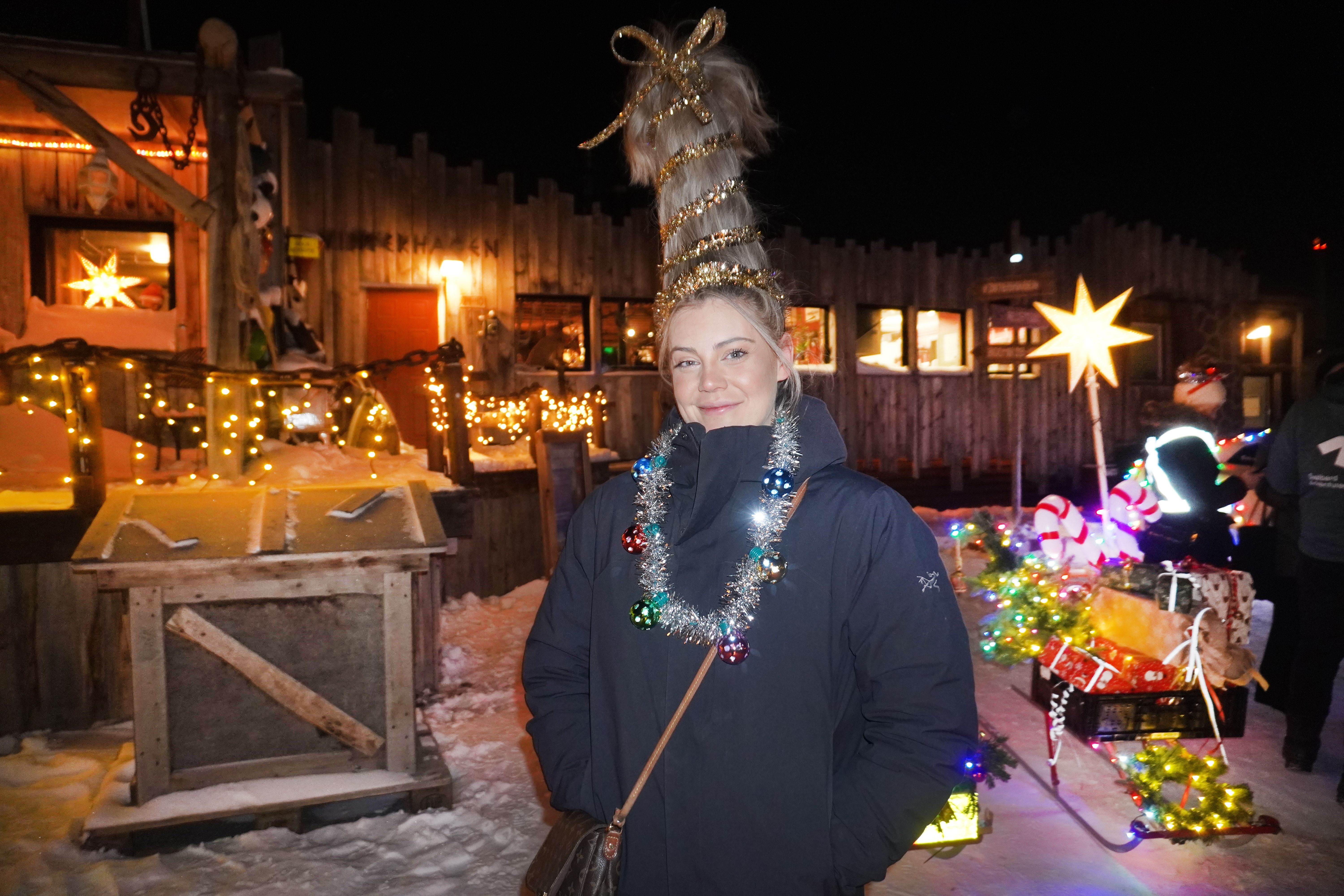 Woman with high hair and Christmas decorations.
