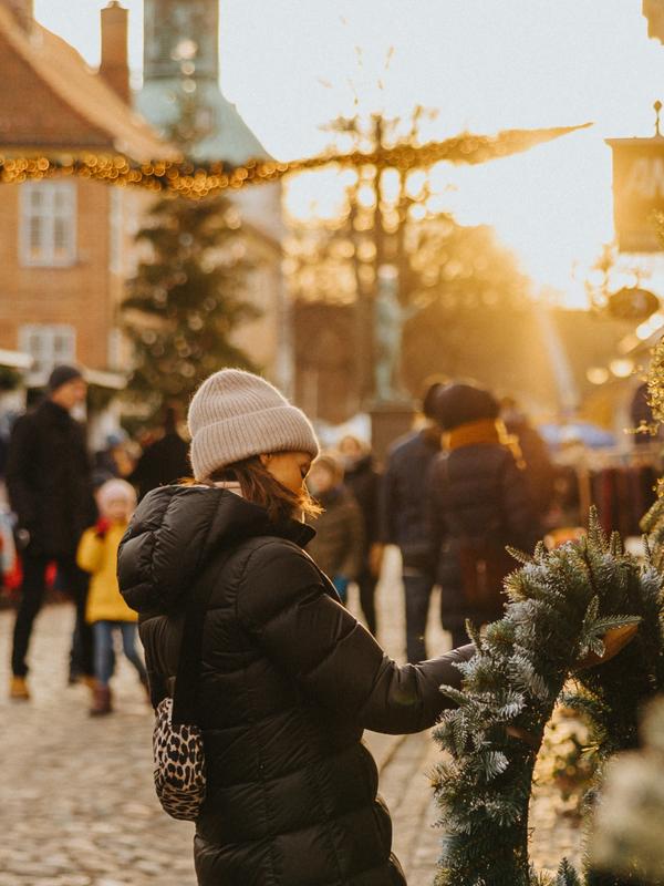 A woman attending Christmas in the old town, Gamlebyen, in Fredrikstad