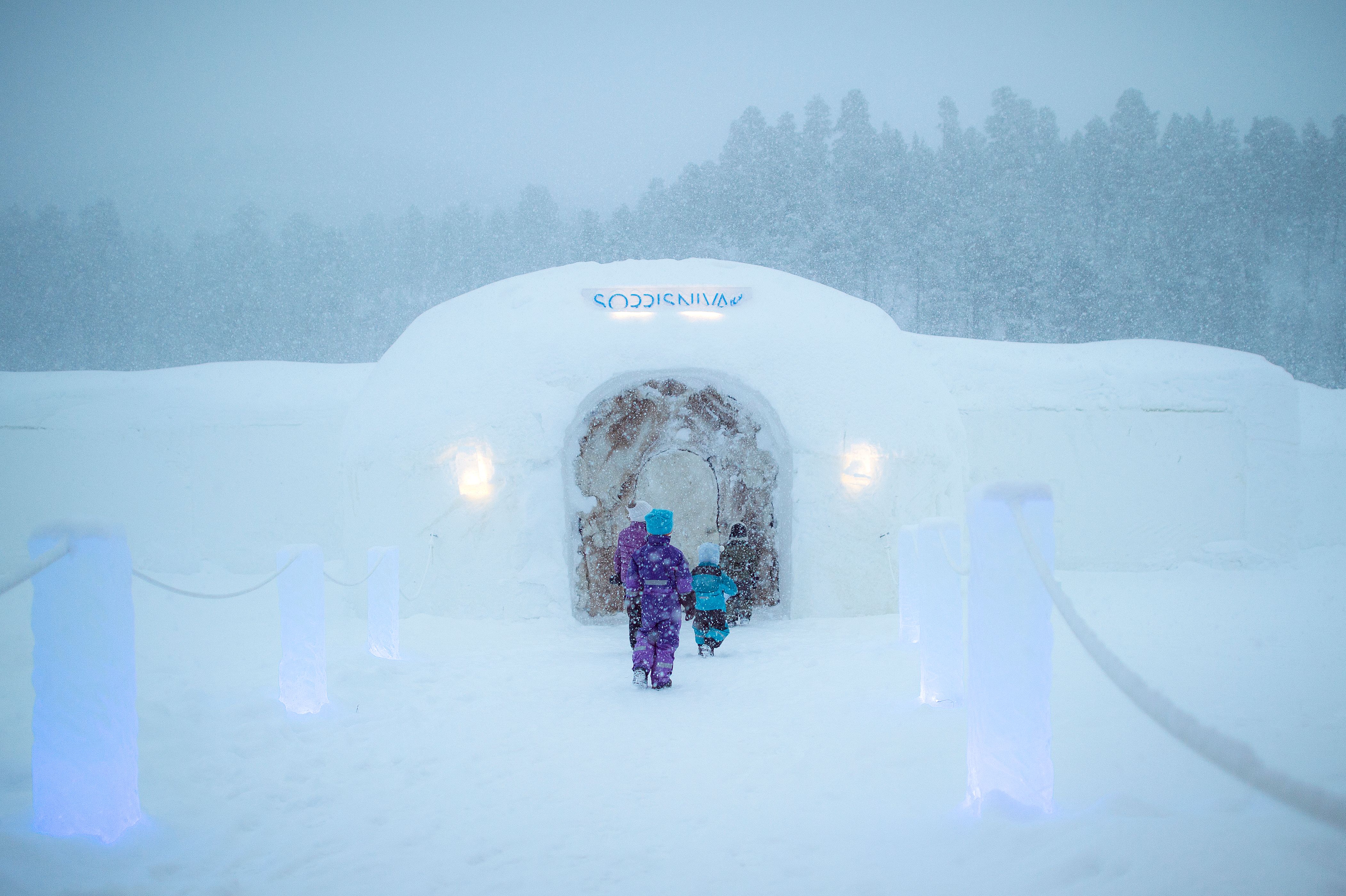 Children entering Sorrisniva Igloo Hotel in Alta, Northern Norway