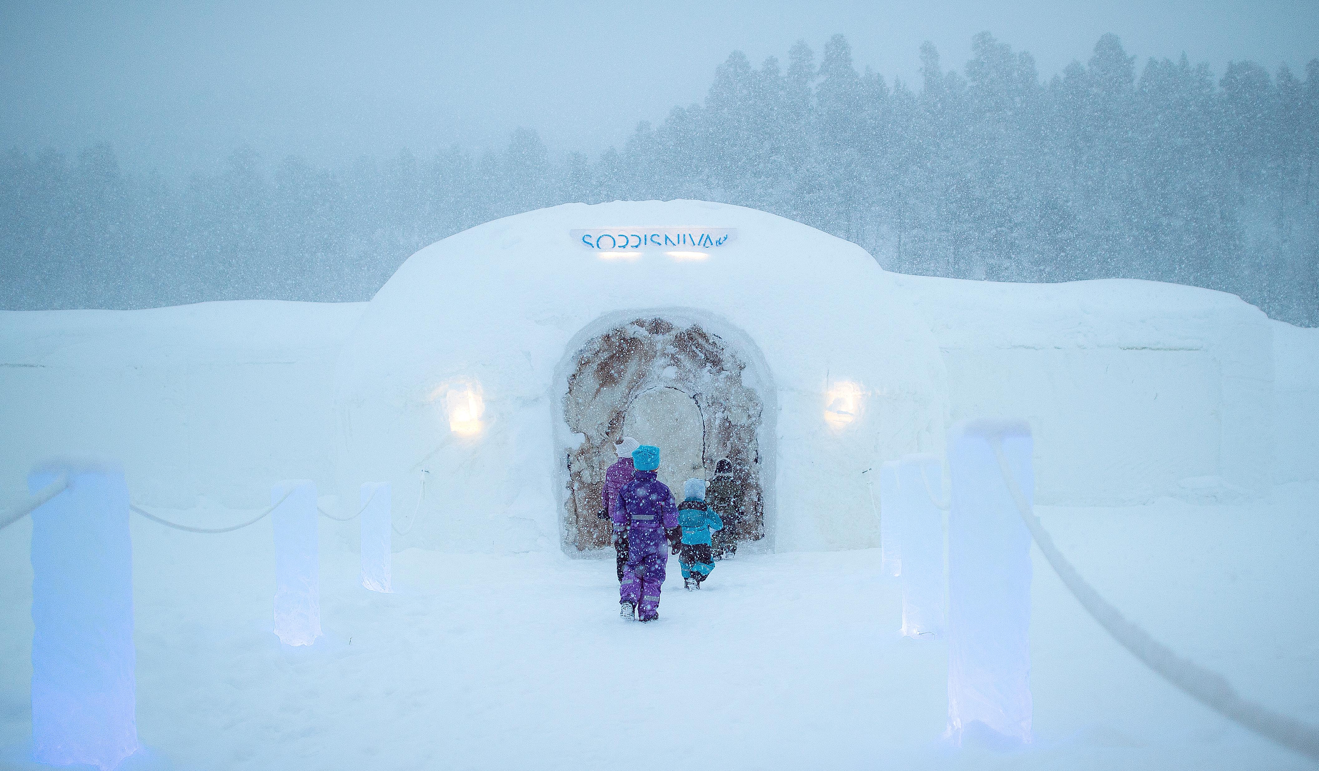 Children entering Sorrisniva Igloo Hotel in Alta, Northern Norway