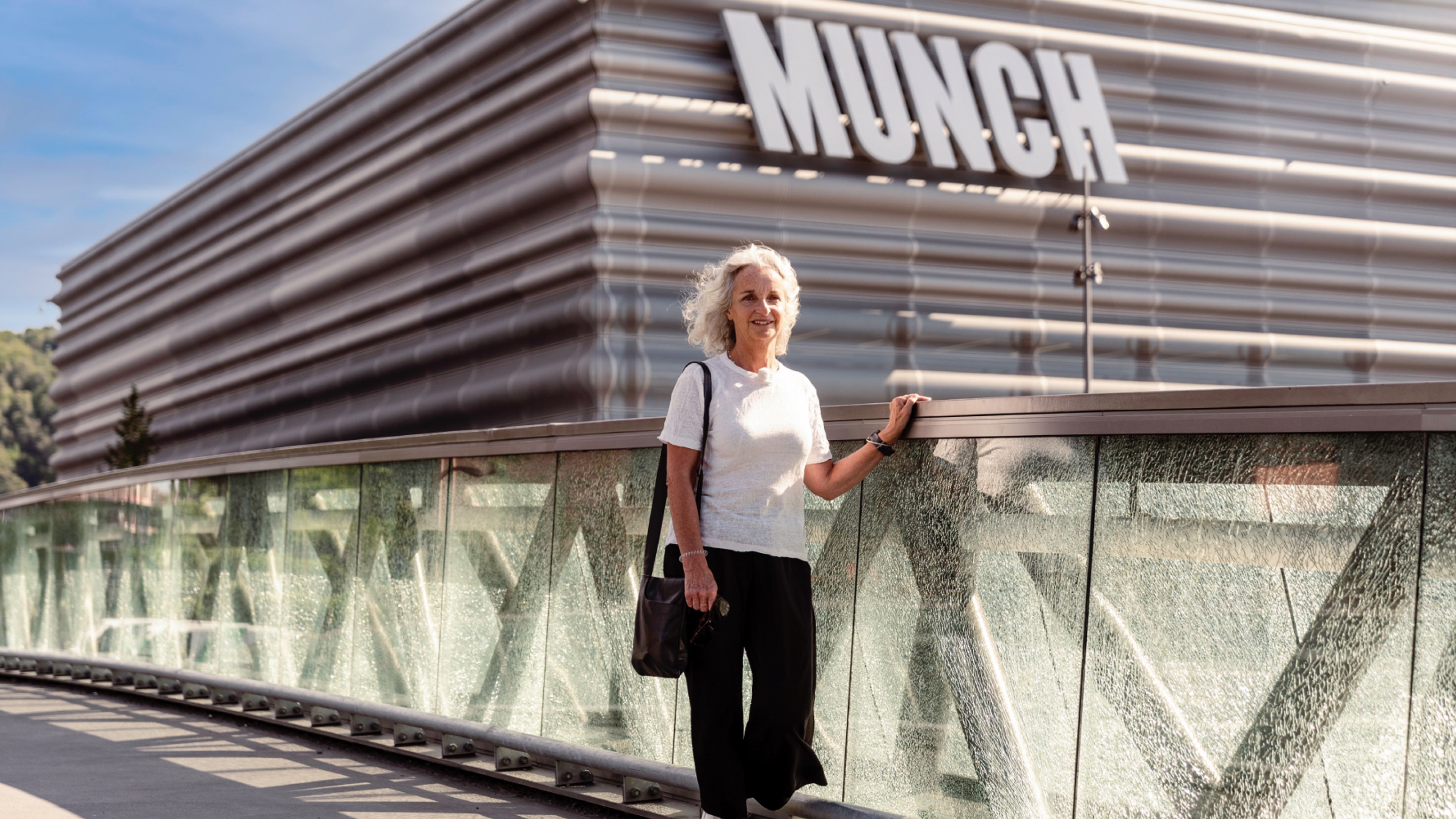 A woman walks past the MUNCH museum
