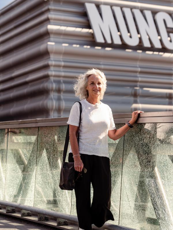 A woman walks past the MUNCH museum