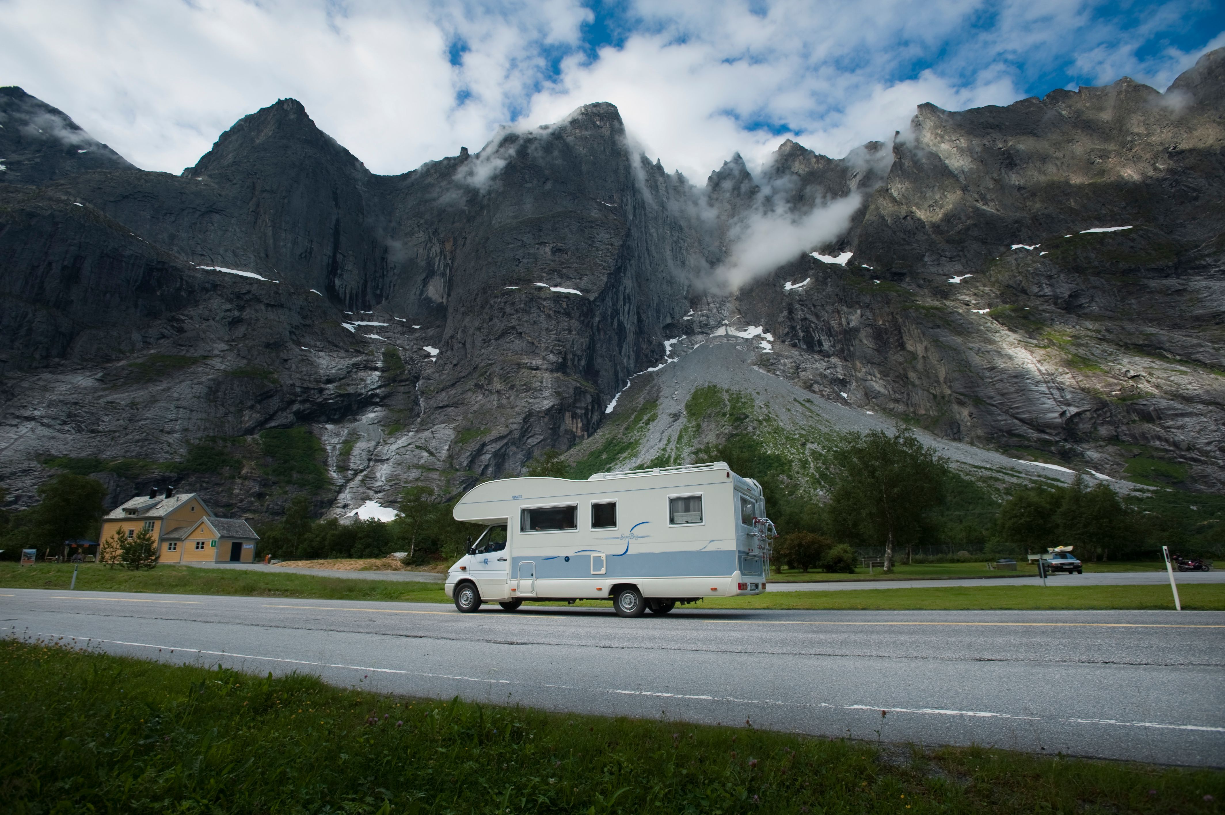 A caravan passing the Troll Wall in Norway