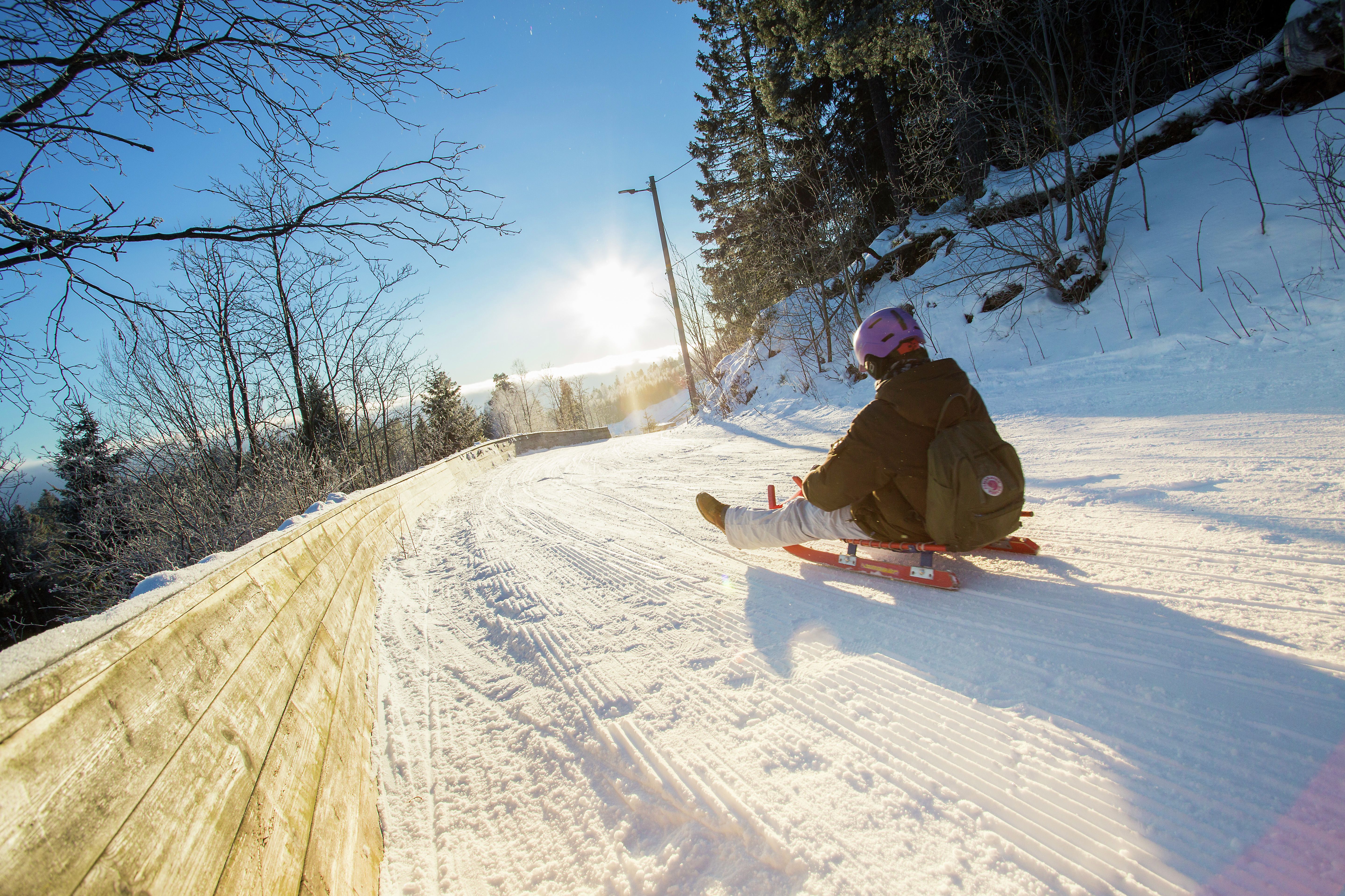 Toboggan run down the slope called Korketrekkeren in Oslo