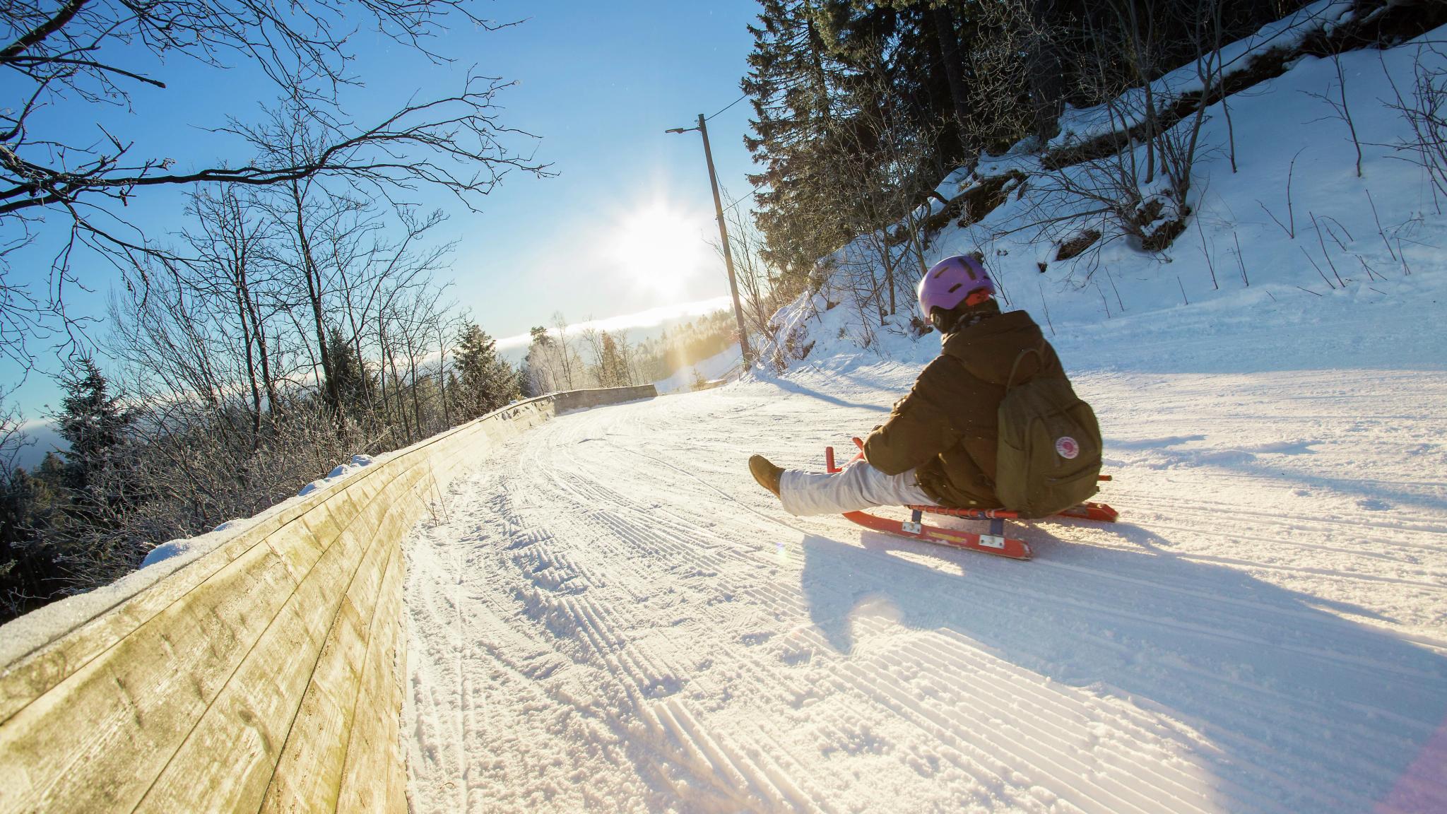 Toboggan run down the slope called Korketrekkeren in Oslo