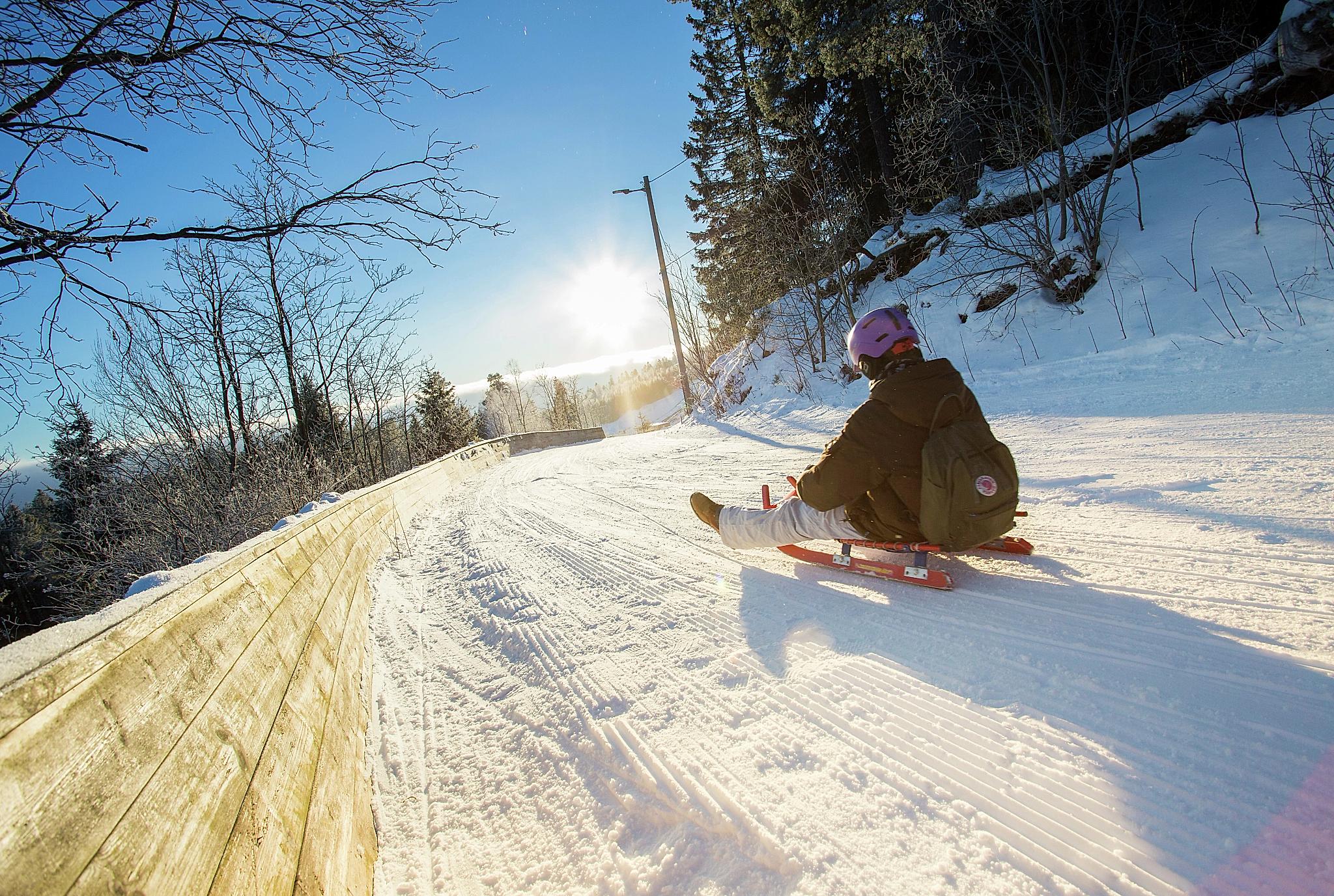 Toboggan run down the slope called Korketrekkeren in Oslo