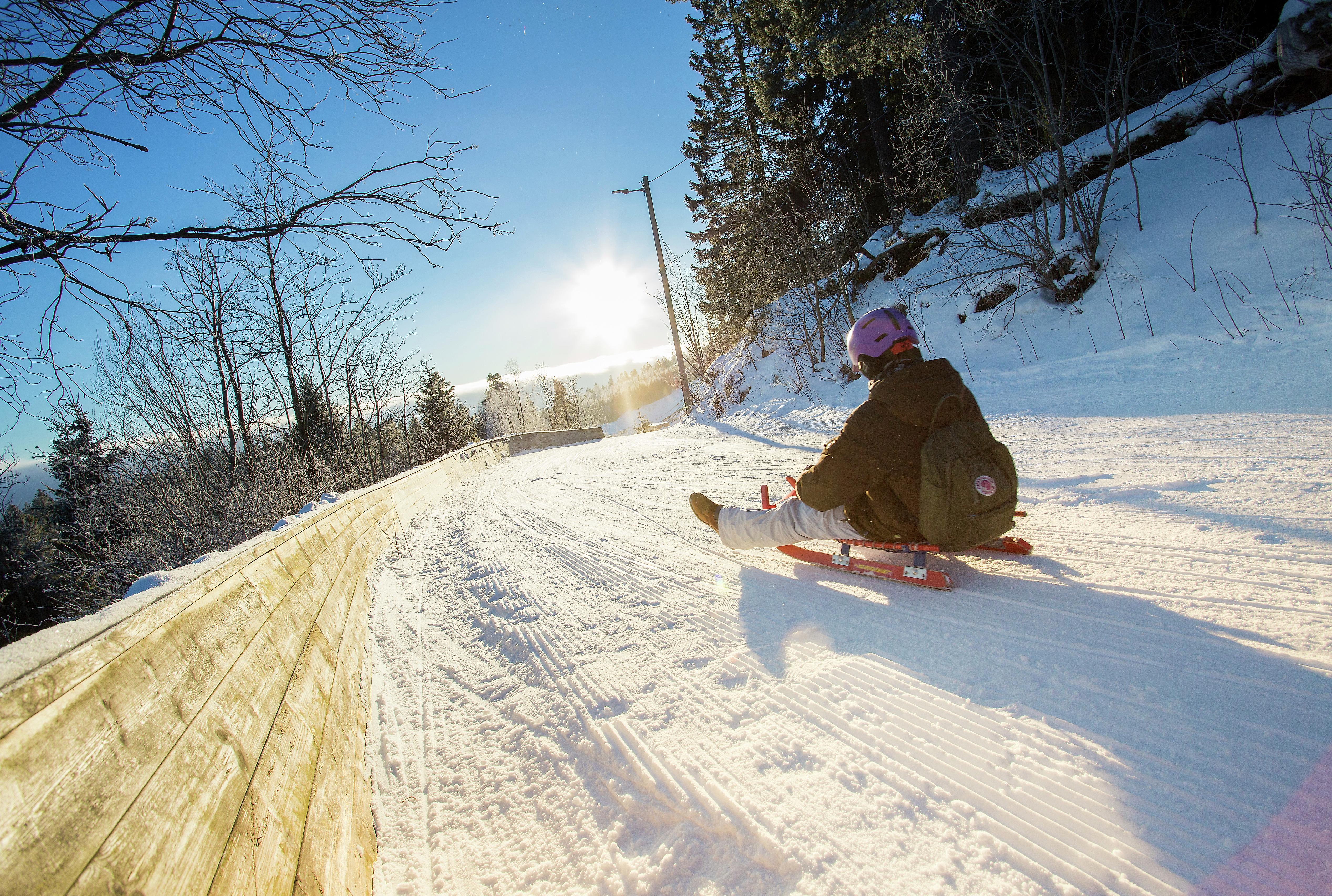 Toboggan run down the slope called Korketrekkeren in Oslo