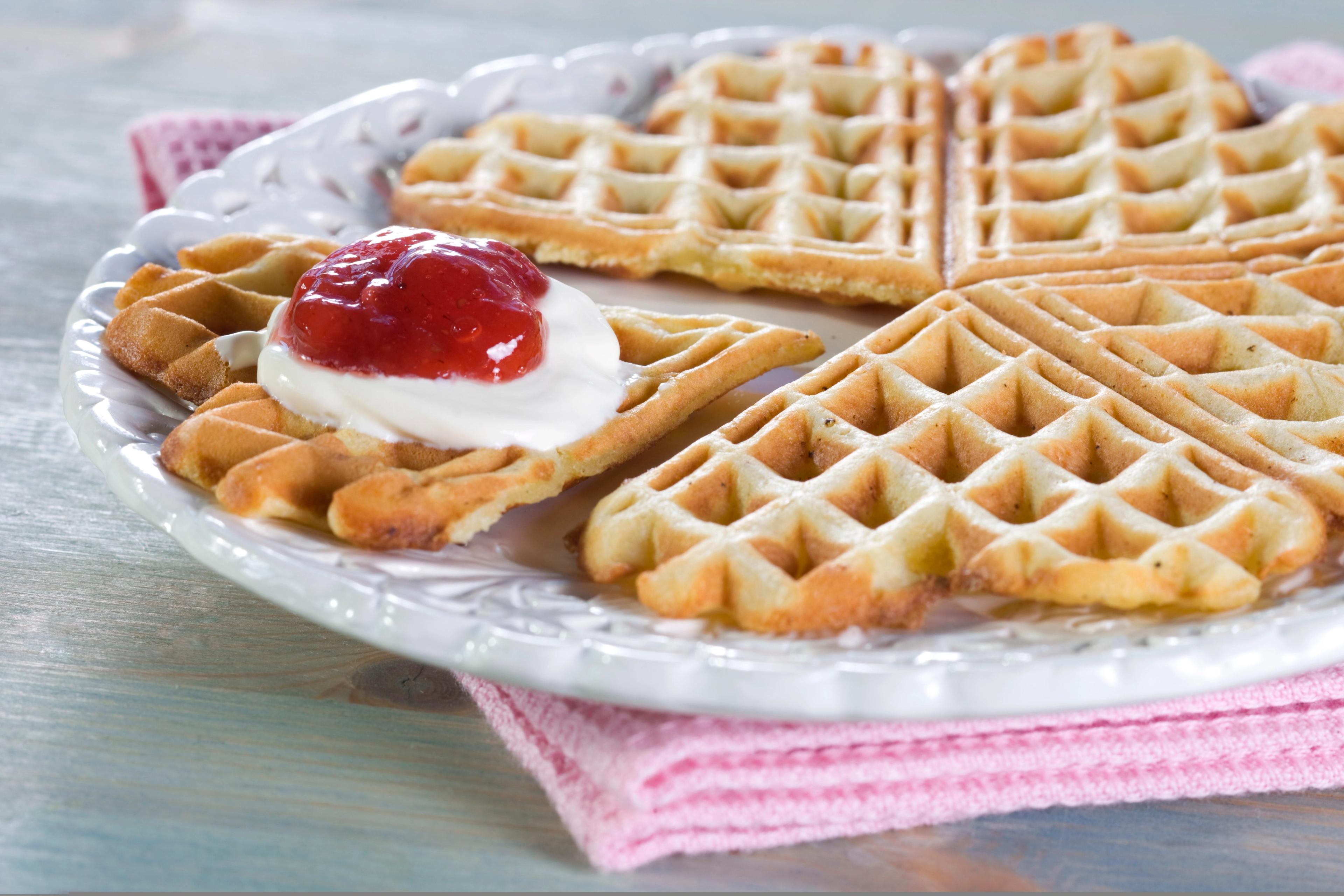 A Norwegian Waffle with sour cream and jam.