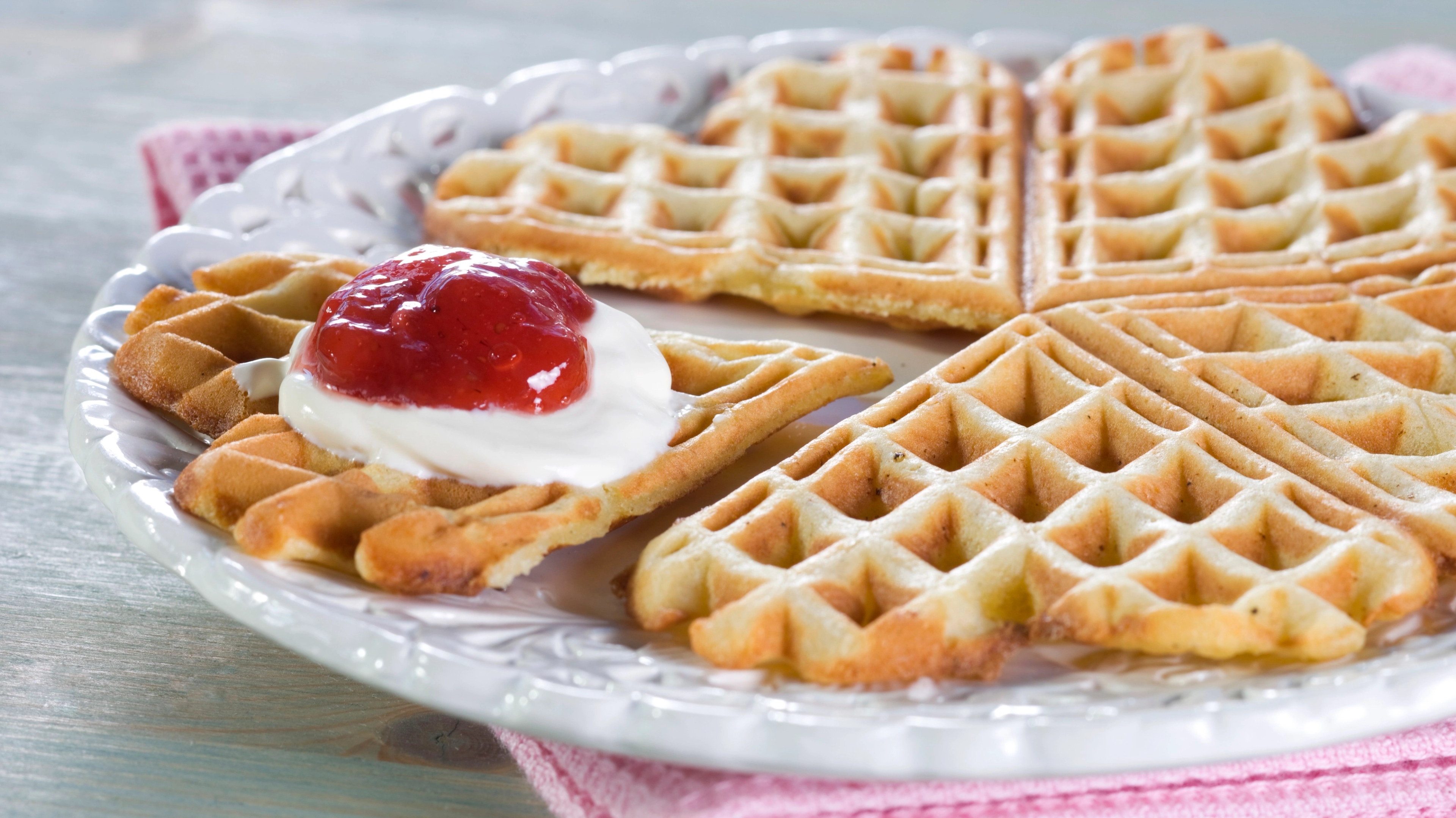 A Norwegian Waffle with sour cream and jam.