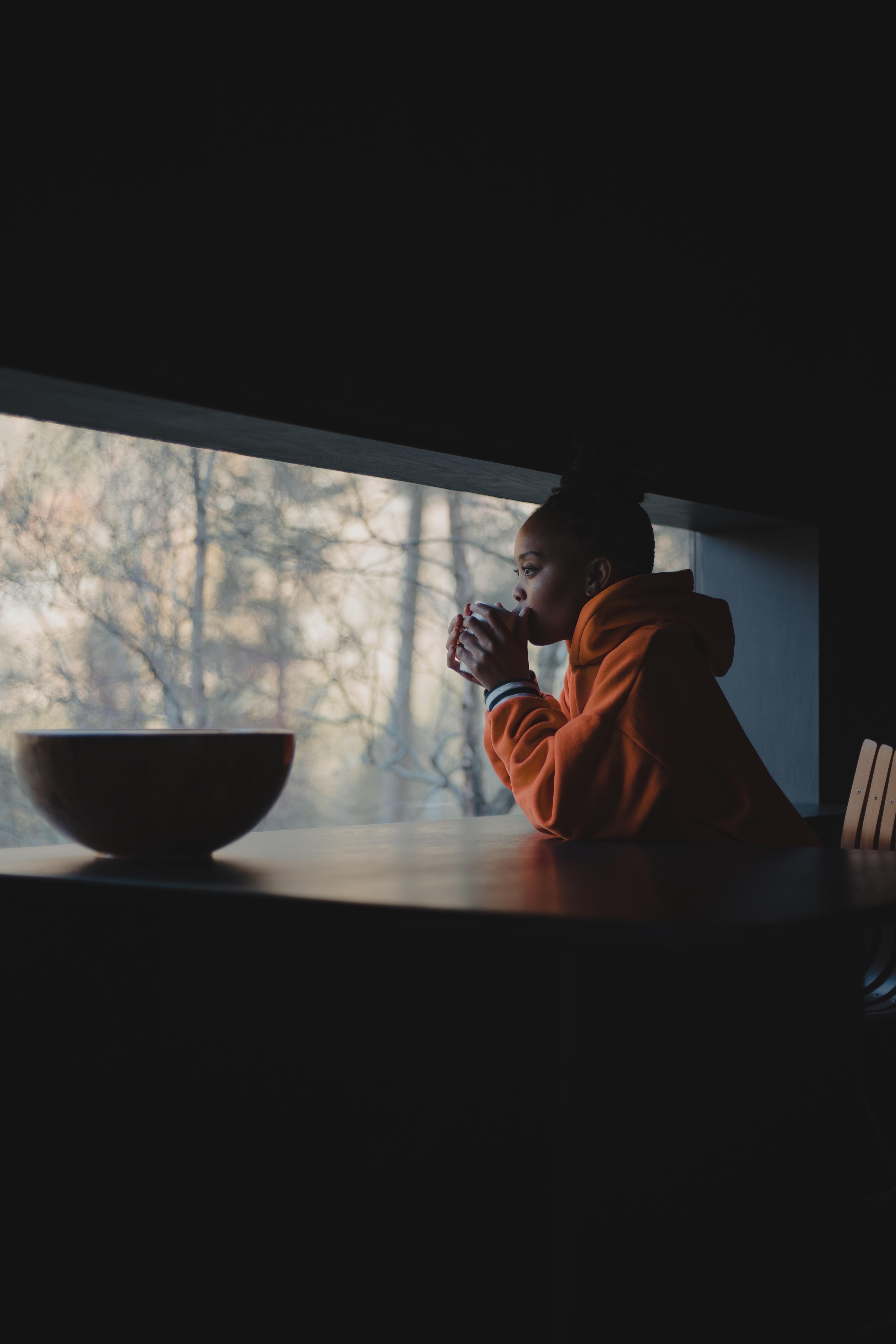 A woman enjoying the view from Juvet landscape hotel