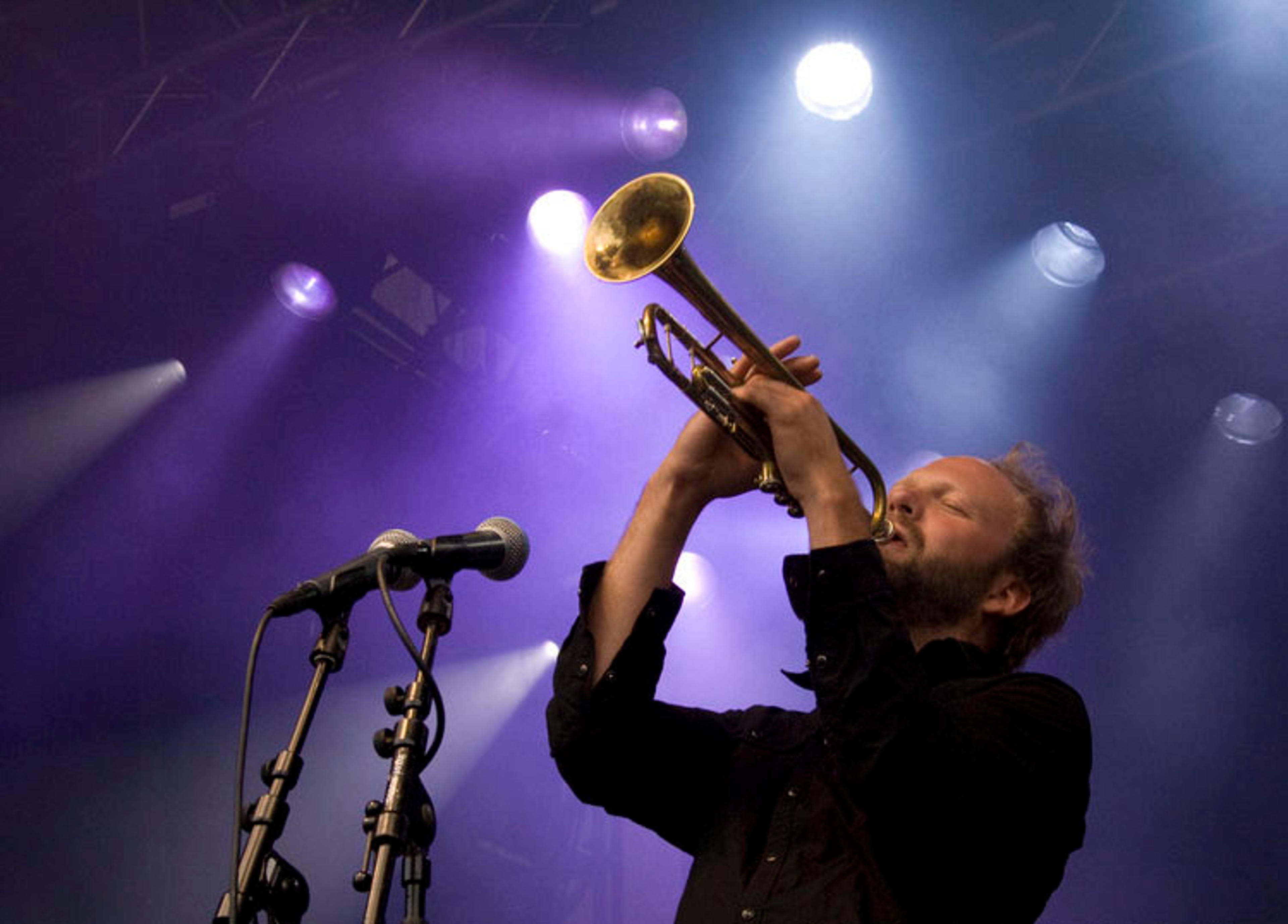 A man is playing the trumpet with his eyes closed at Moldejazz in Northwest, Fjord Norway.