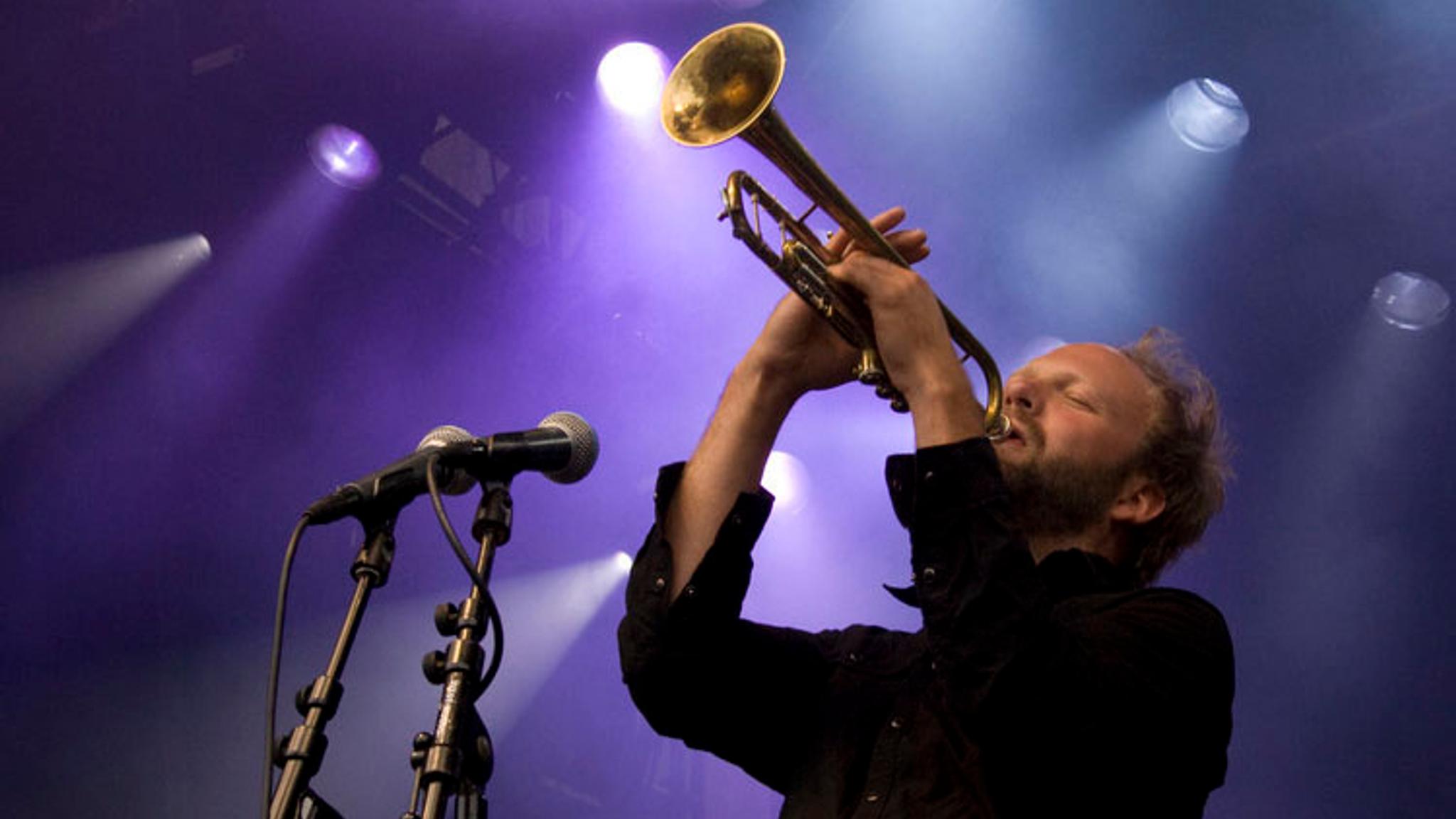 A man is playing the trumpet with his eyes closed at Moldejazz in Northwest, Fjord Norway.