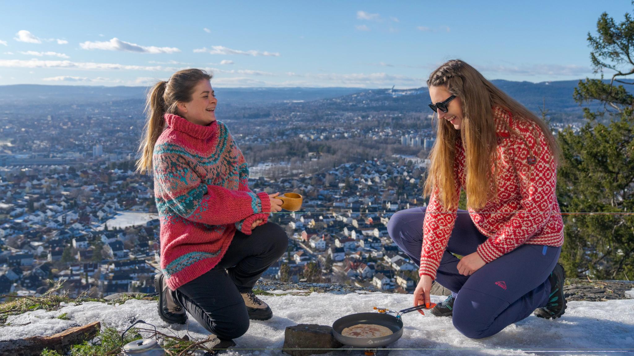 To friends making pancakes outdoors