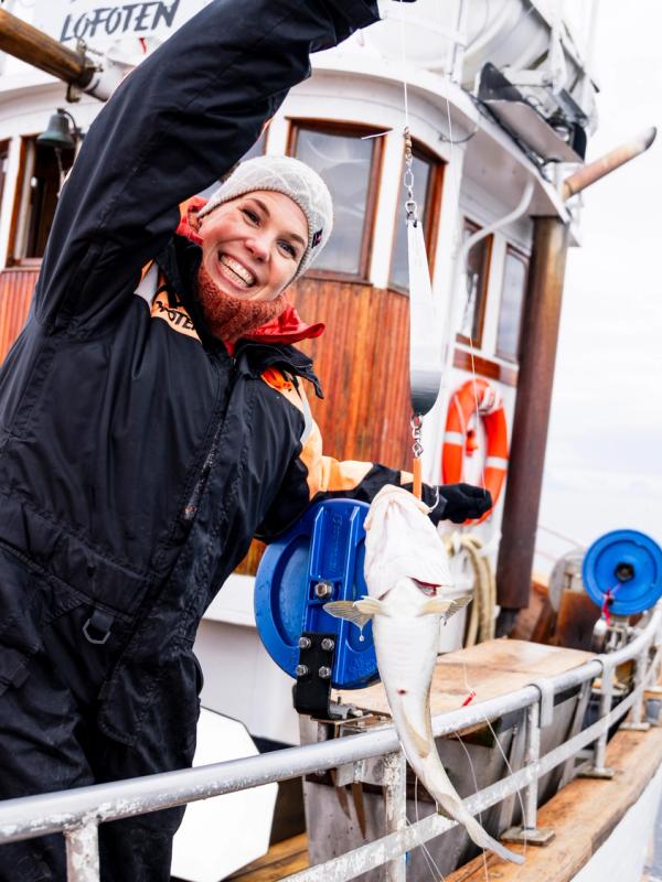 A woman catching a fish