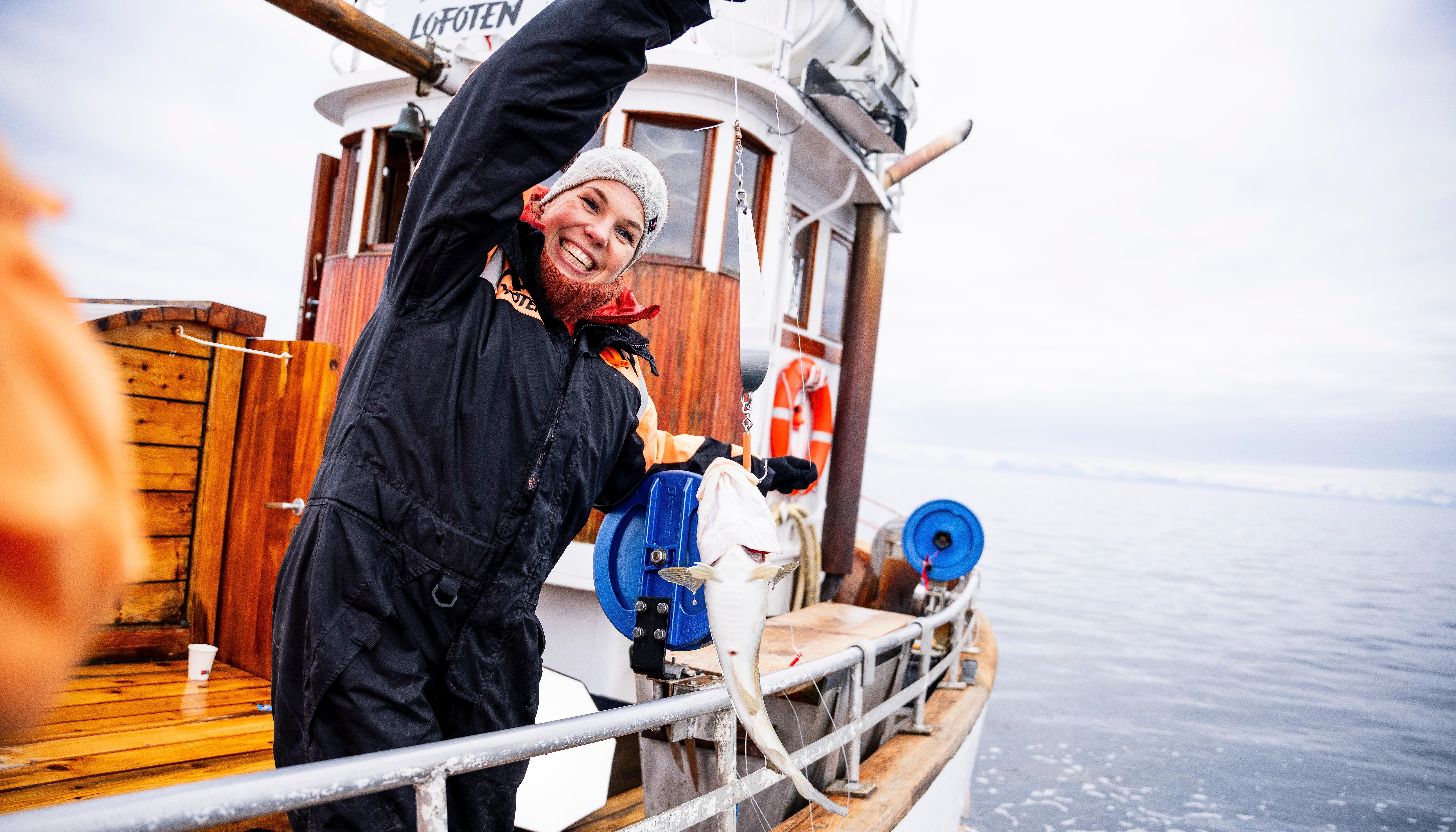 A woman catching a fish