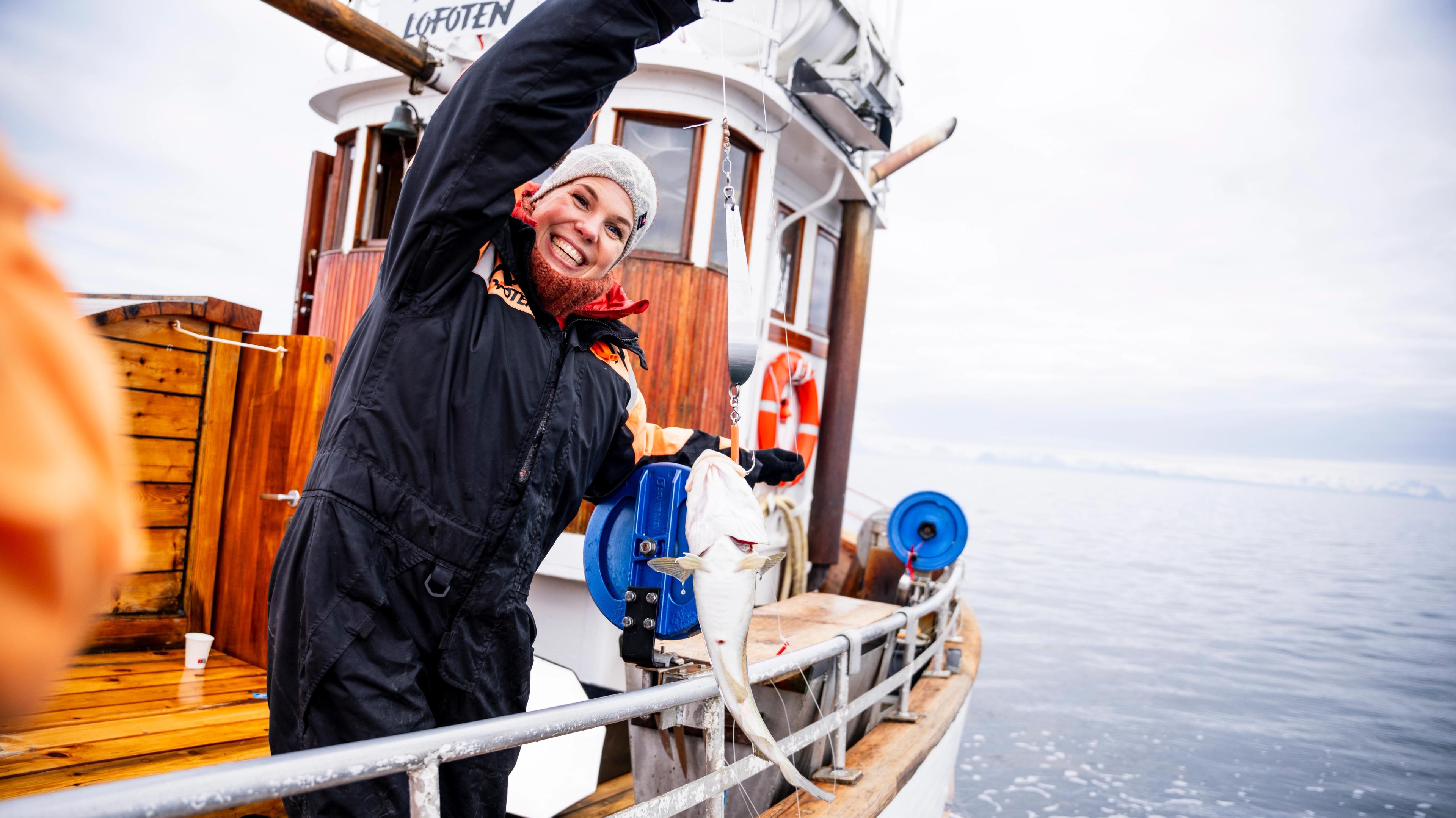 A woman catching a fish