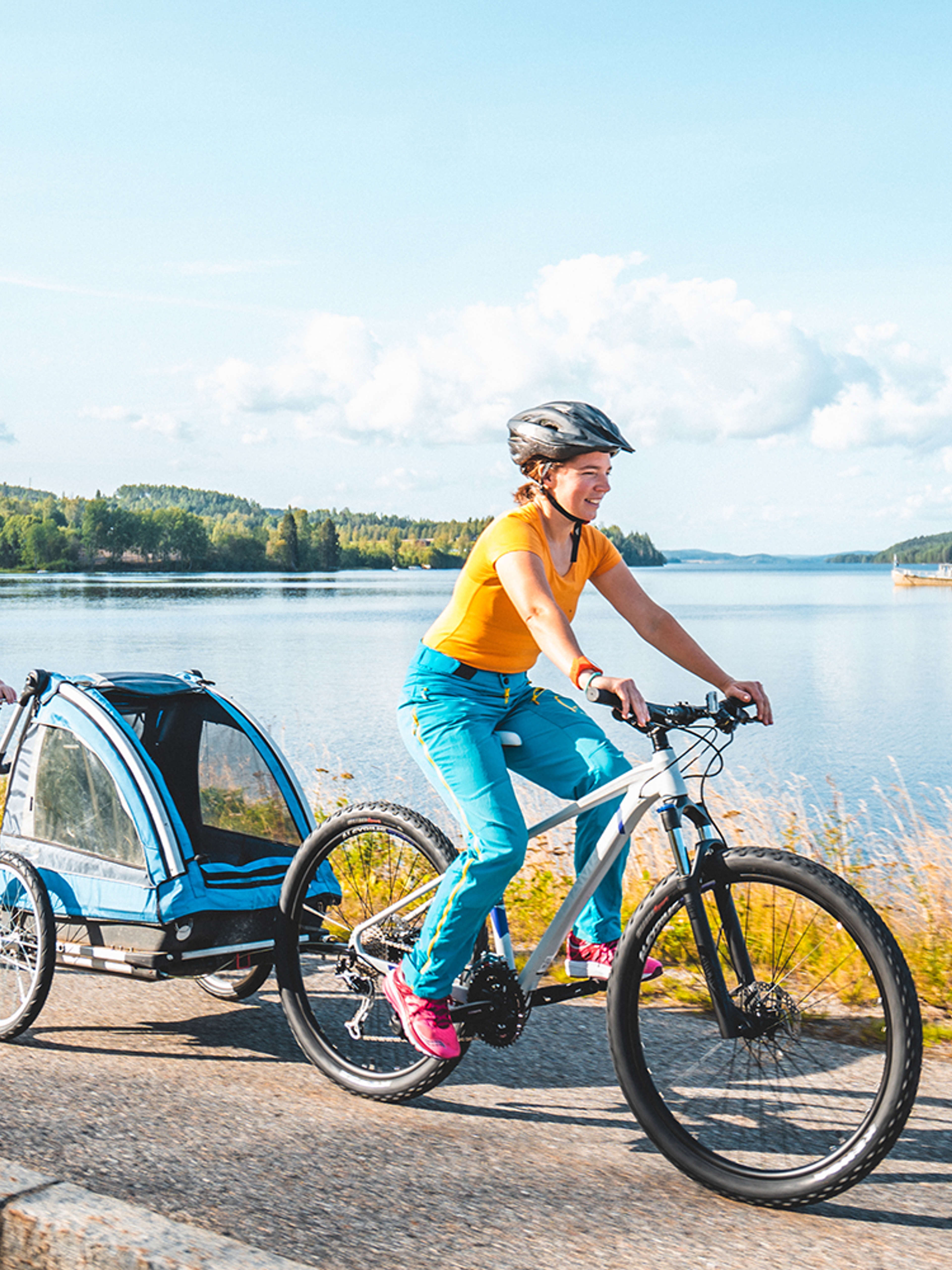 People cycling along the lake in Inner Østfold, Eastern Norway