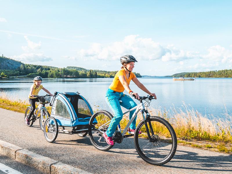 People cycling along the lake in Inner Østfold, Eastern Norway