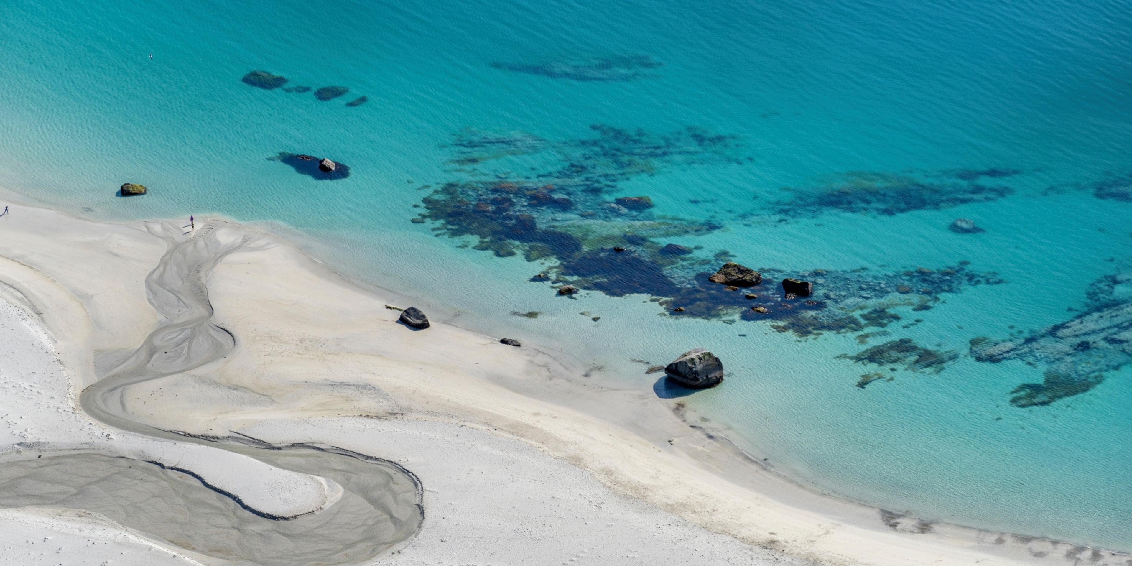 The turquoise water of the Hauklandstranda beach in Lofoten in Northern Norway