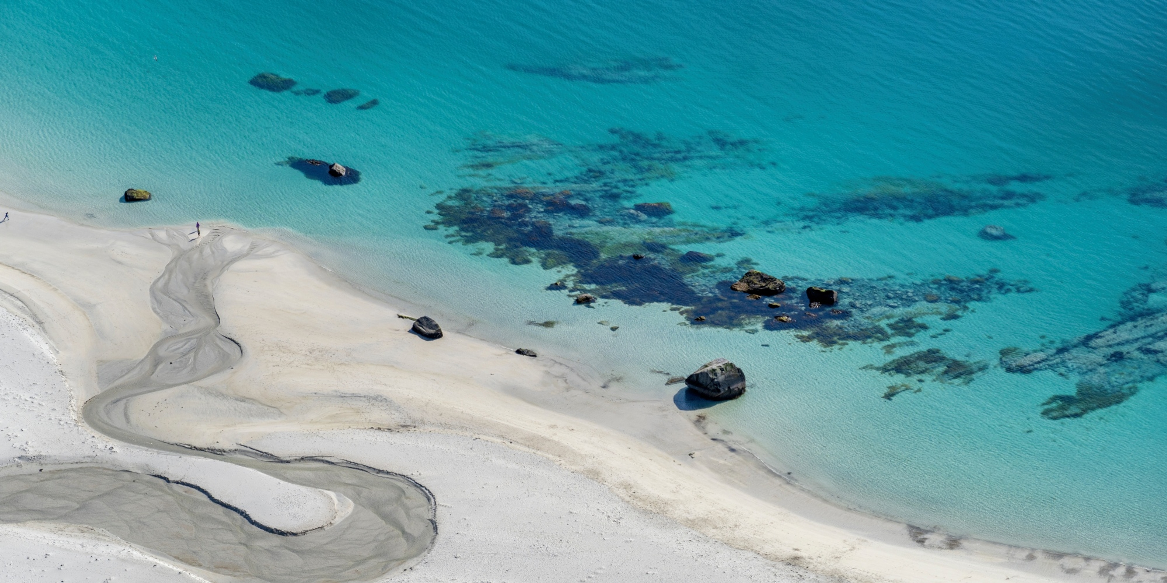 The turquoise water of the Hauklandstranda beach in Lofoten in Northern Norway