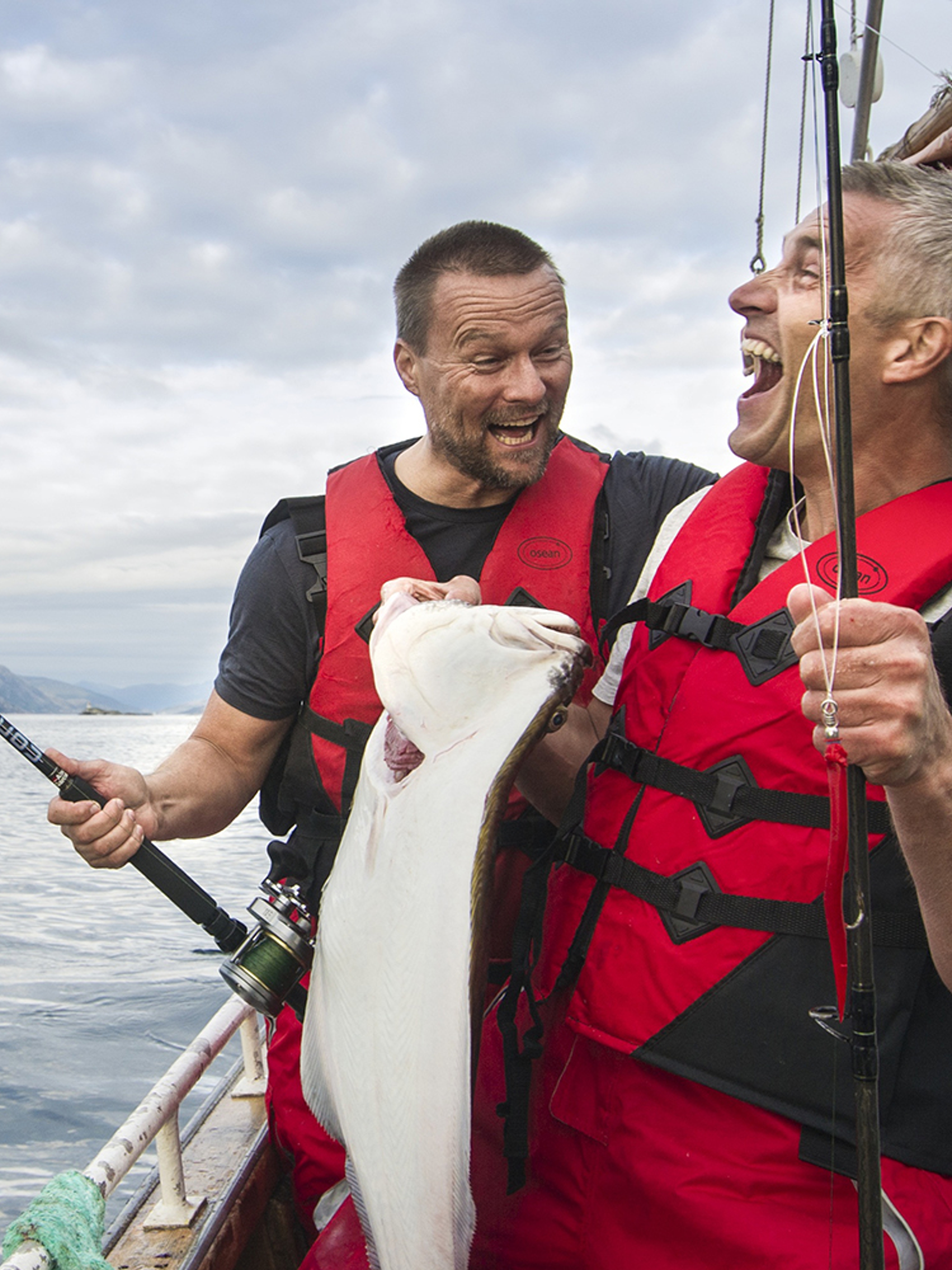 Two men in a boat sea fishing in Tromsø in Northern Norway